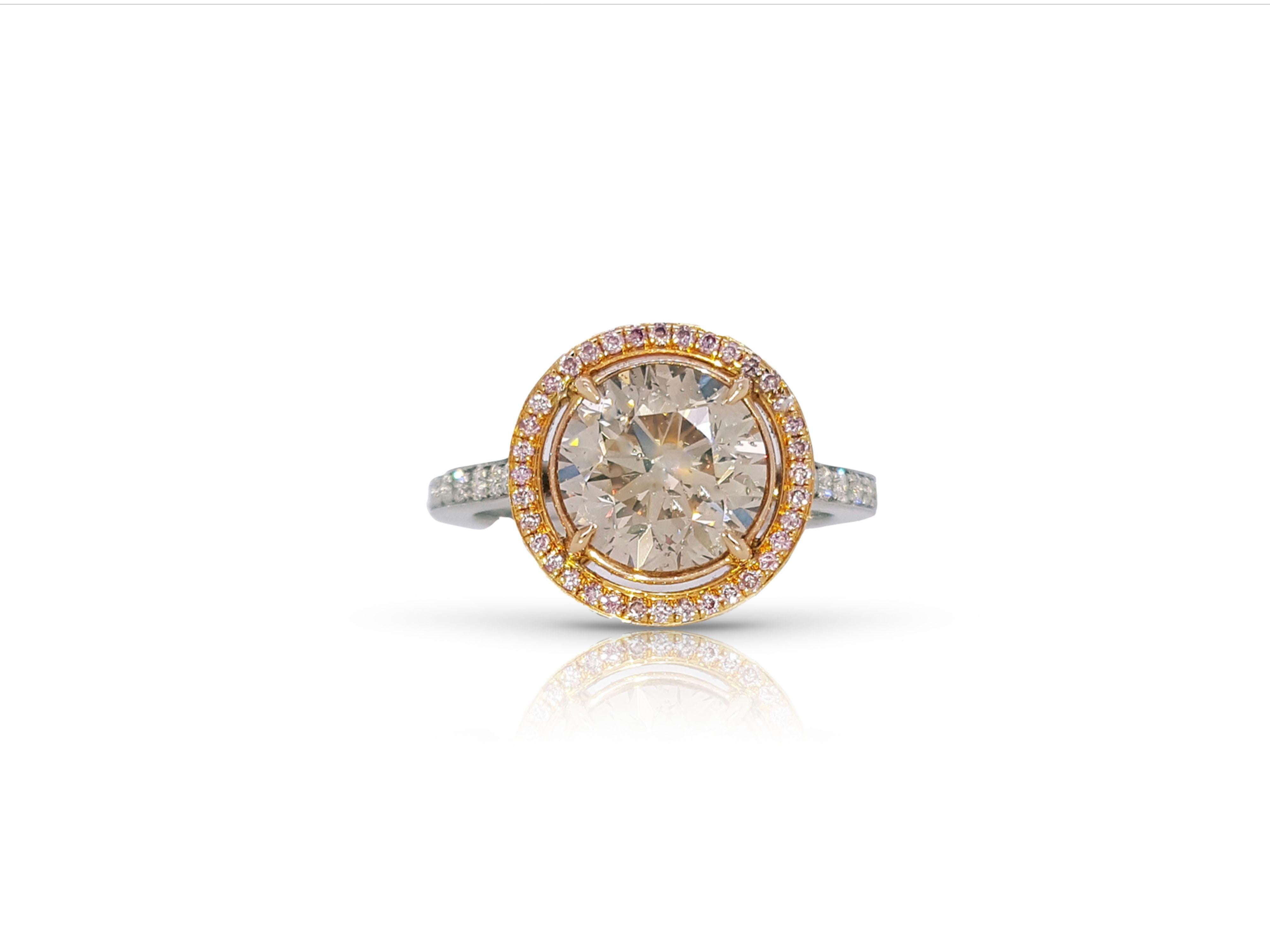 Engagement ring style showcasing a 2.91 carat Brown, round brilliant cut diamond at the center
The classic design brings out the beauty of the center stone with the surrounding 78 round pink diamonds and 40 white diamonds weighing approximately 0.79