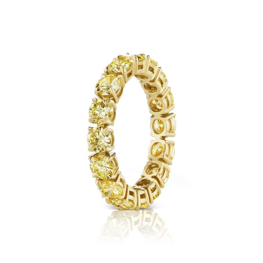 This beautiful and understated Ring features Round Brilliant Cut Yellow Diamonds.
16 Yellow Diamonds weigh 3.70 Carats.
Set in 18 Karat Yellow Gold.
Finger Size 6.5.
Pictured as stackable too.