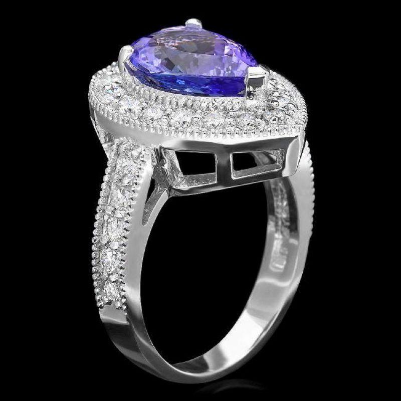 3.bague en or blanc massif 14K avec tanzanite naturelle de 70 carats et diamant

Le poids total de la tanzanite naturelle est de : Environ 2,70 carats 

Mesures de la tanzanite : Environ 12.00 x 8.00mm

Diamants ronds naturels Poids : Environ 1.00