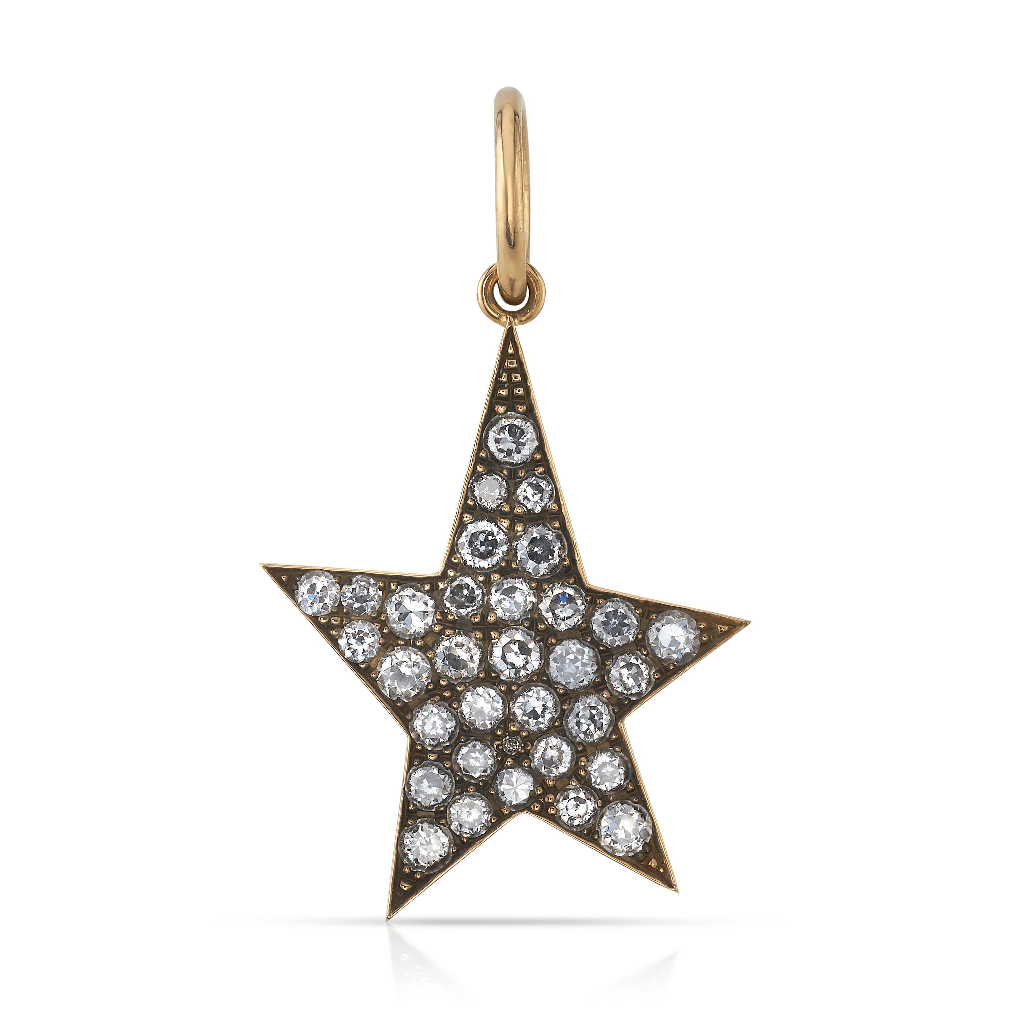 Approximately 4.00ctw G-H/VS-SI old European cut diamonds pave set in a handcrafted asymmetrical 18K yellow gold star charm. Available in an oxidized or polished finish. Charm measures 30mm x 40mm. 

Price does not include chain.

*Stone weight may