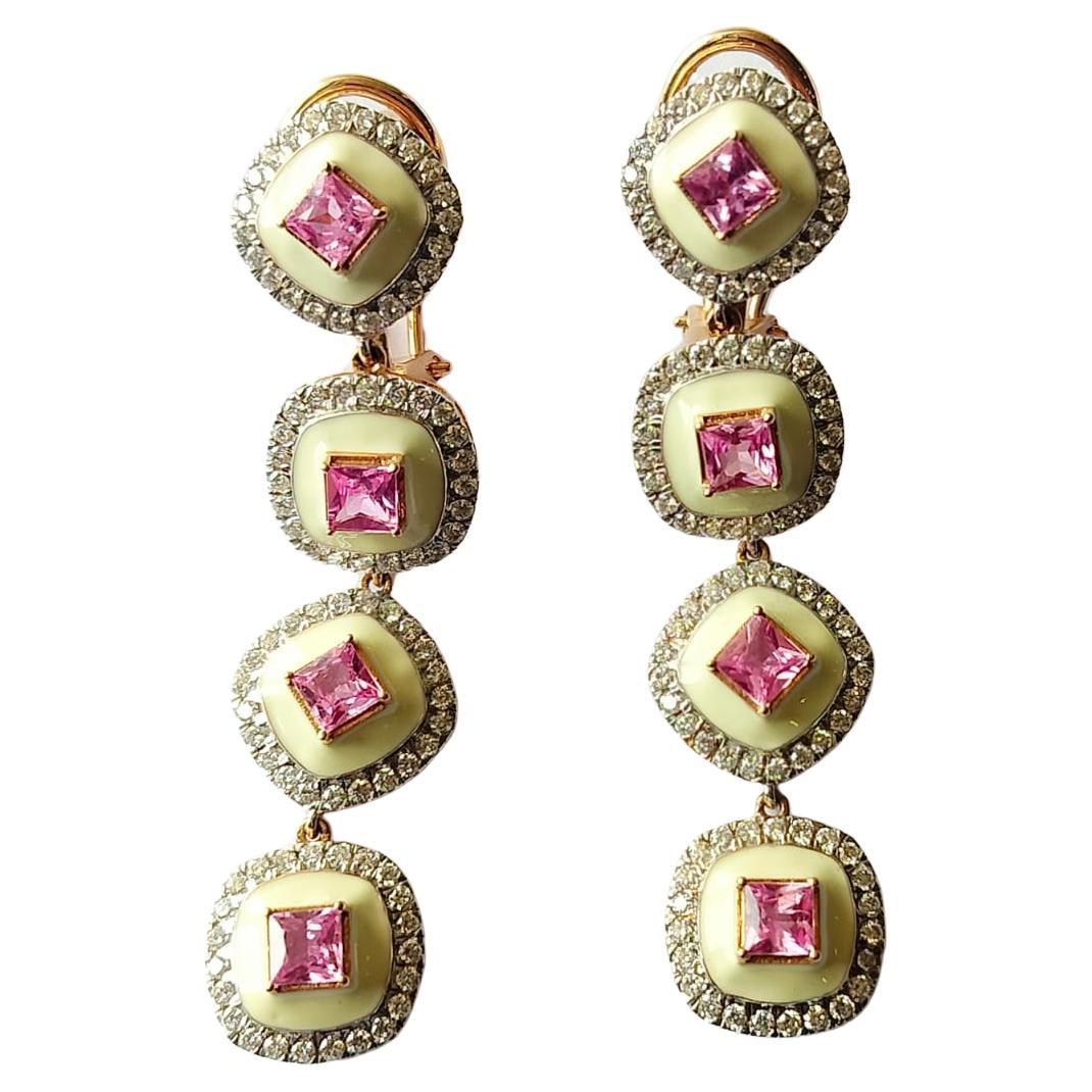A very gorgeous and Modern Style Pink Sapphire Chandelier / Dangle Earrings set in 18K Gold & Diamonds. The weight of the Pink Sapphire is 3.7 carats.  The Pink Sapphires are of Madagascar origin. The weight of the Diamonds is 1.57 carats. Net Gold