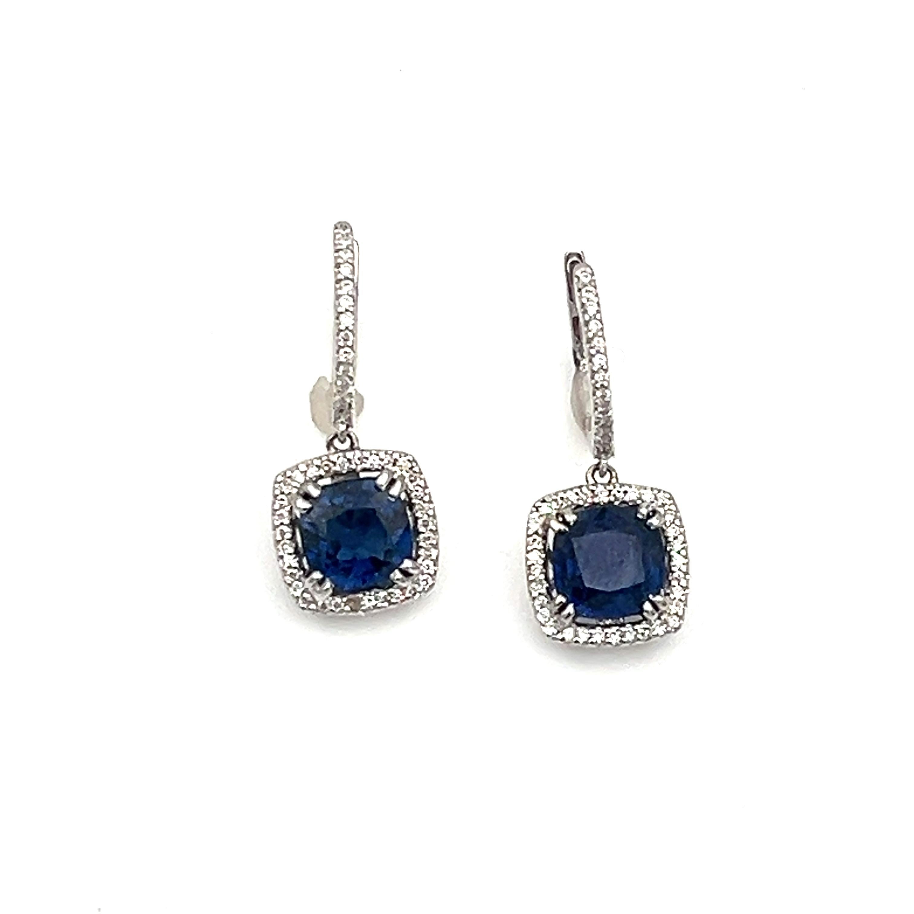 These gorgeous natural heat treated sapphires and diamond earrings will complete any wardrobe. 3.71 total carats, the diamonds surrounding the natural sapphire are a F/G in color with a VS2/SI1 in clarity.