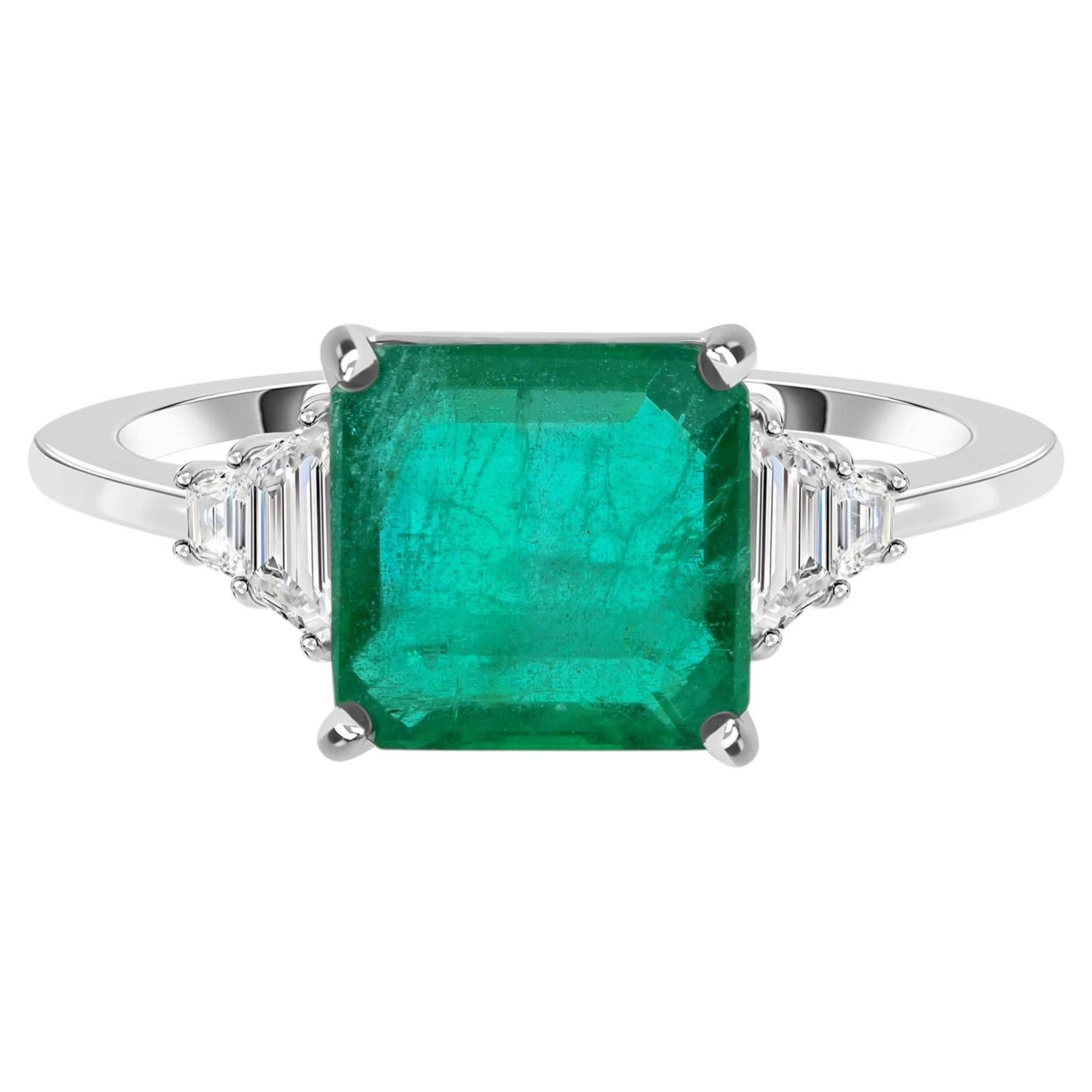 For Sale:  3.71 TCW Natural Emerald-Cut Emerald Three-Stone Ring 18k White Gold