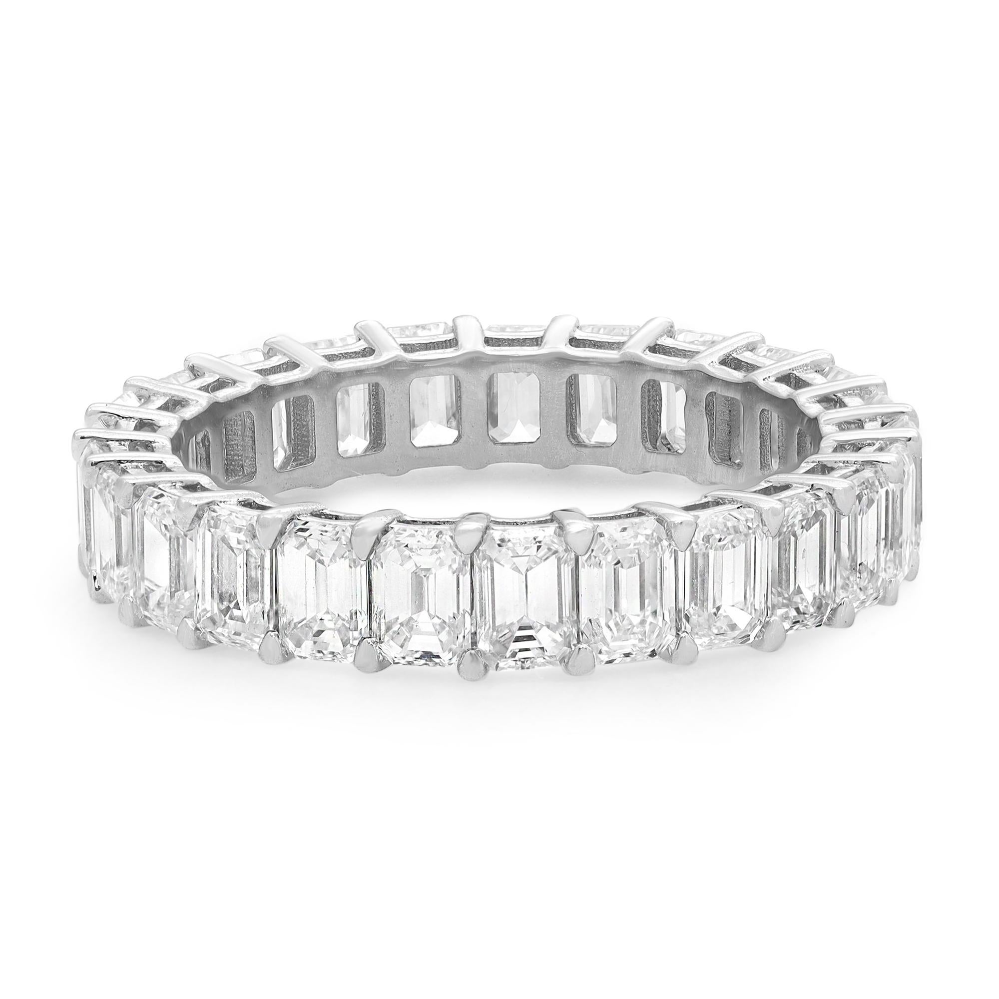 This classic diamond eternity ring makes a standout addition to your jewelry collection. It features 25 prong set Emerald cut sparkling diamonds, crafted in an 18k white gold band. Total diamond weight: 3.71carats. Diamond quality: color G-H clarity