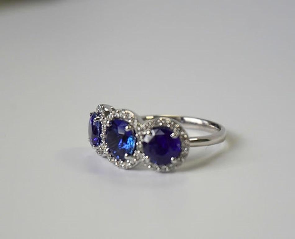 Round Cut 3.72 Carat Round Sapphire Three Stone Halo Ring For Sale