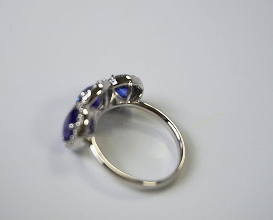 3.72 Carat Round Sapphire Three Stone Halo Ring In New Condition For Sale In New York, NY