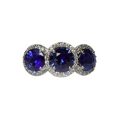 3.72 Carat Round Sapphire Three Stone Halo Ring