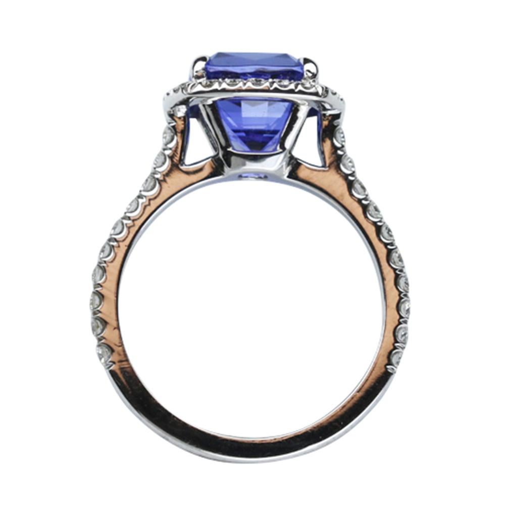 Elegant & finely detailed Solitaire Cocktail Engagement  Ring, center set with a securely nestled 3.72 Carat Cushion-cut Vivid Blue Tanzanite, clarity: internally flawless (IF); dimensions: 9.0mm x 8.3mm, surrounded by Brilliant full cut Diamonds,