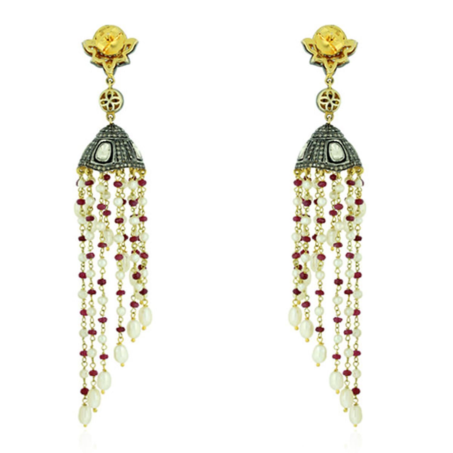 These stunning tassel earrings are handmade in 18-karat gold & sterling silver. It is set in 37.22 carats pearl, 12.7 carats ruby and 3.22 carats of diamonds in blackened finish. 

FOLLOW  MEGHNA JEWELS storefront to view the latest collection &