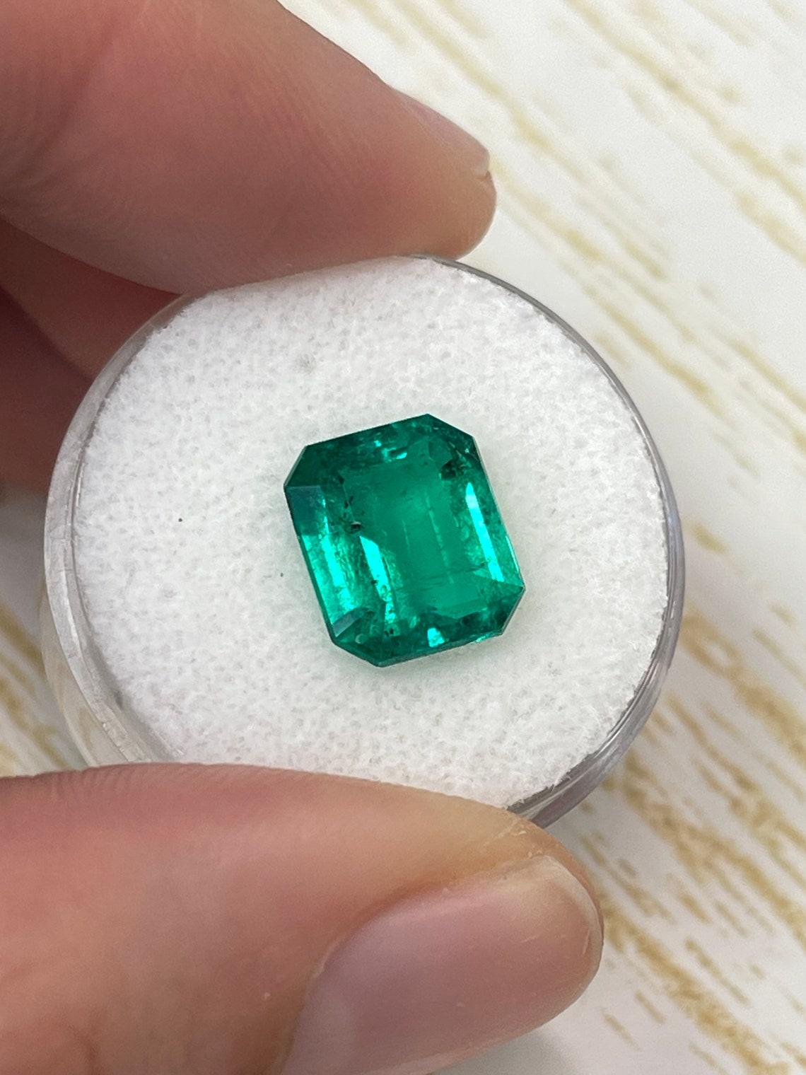 3.72ct AAA+ Perfect Green Freckled Colombian Emerald 11x9mm Emerald Cut May In New Condition For Sale In Jupiter, FL