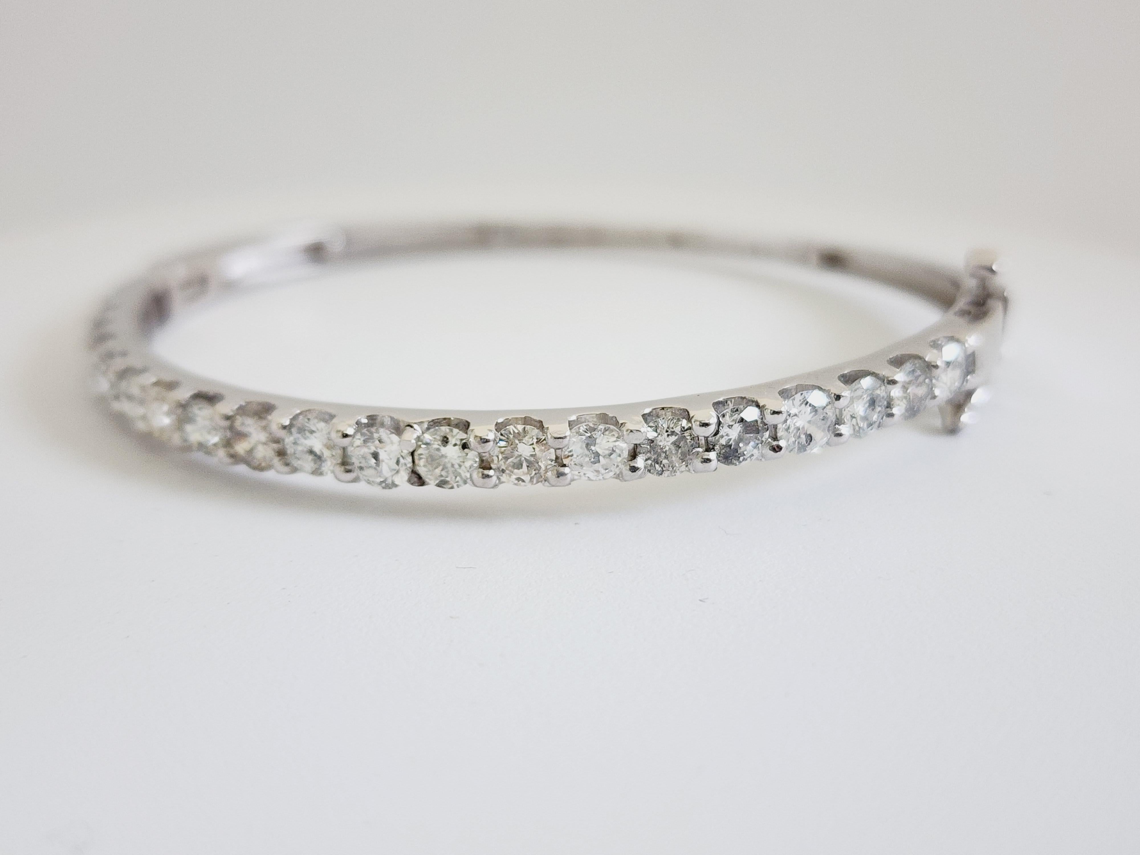 Natural Diamonds 3.73 ctw half way around bangle white gold 14k 7 Inch. 
Average Color I Clarity H, 3.9 mm wide.