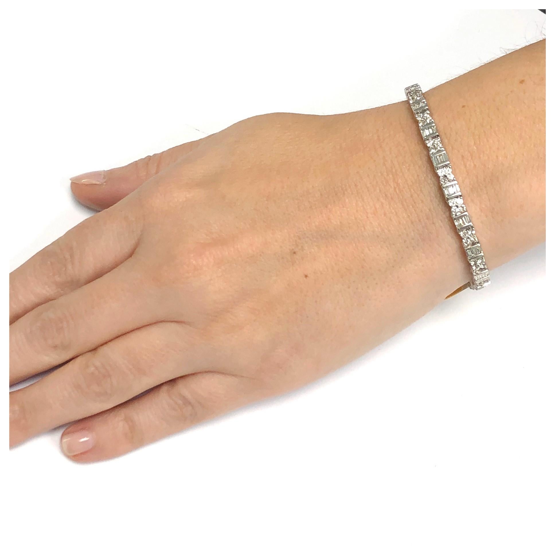 3.73 Ct. total weight of diamond baguette and round diamond are G color and SI1-VS1 clarity. This tennis bracelet is 18 Kt. white and 7 inches in length. It is 4.5 millimeter wide. If you don't see something, say something! We are a custom jewelry