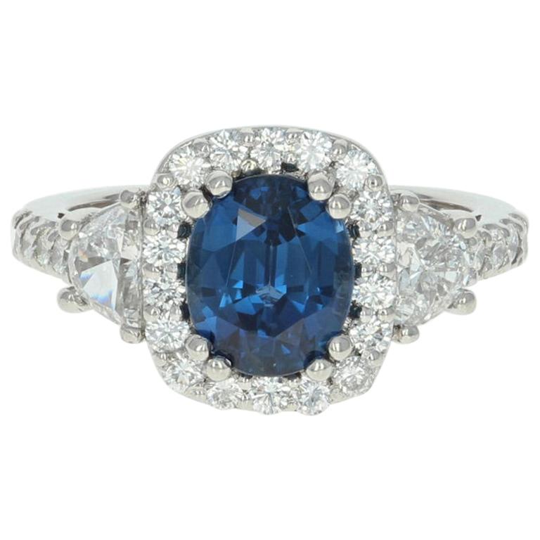 3.73 Carat Oval Cut Sapphire and Diamond Ring, Platinum Halo Half Moon Accents