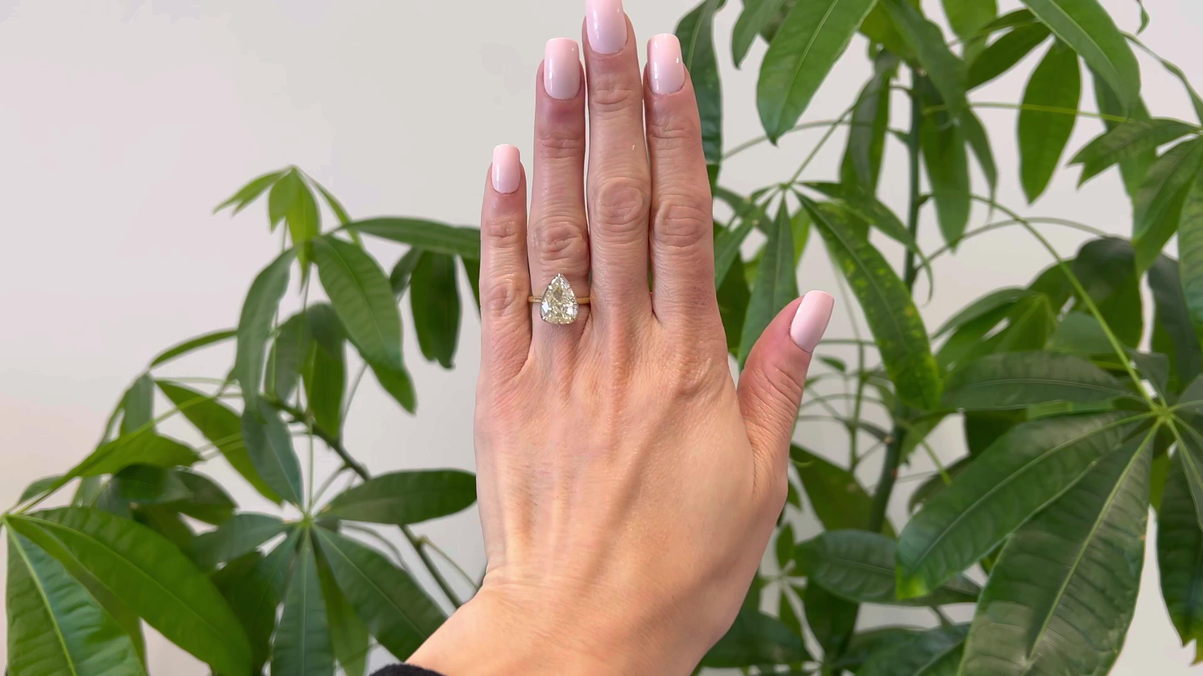 One GIA 3.73 Carats Pear Cut Diamond 18k Yellow Gold Platinum Solitaire Ring. Featuring one pear cut diamond of 3.73 carats, accompanied with GIA #5222845145 stating the diamond is M color, SI2 clarity. Crafted in 18 karat yellow gold with diamond