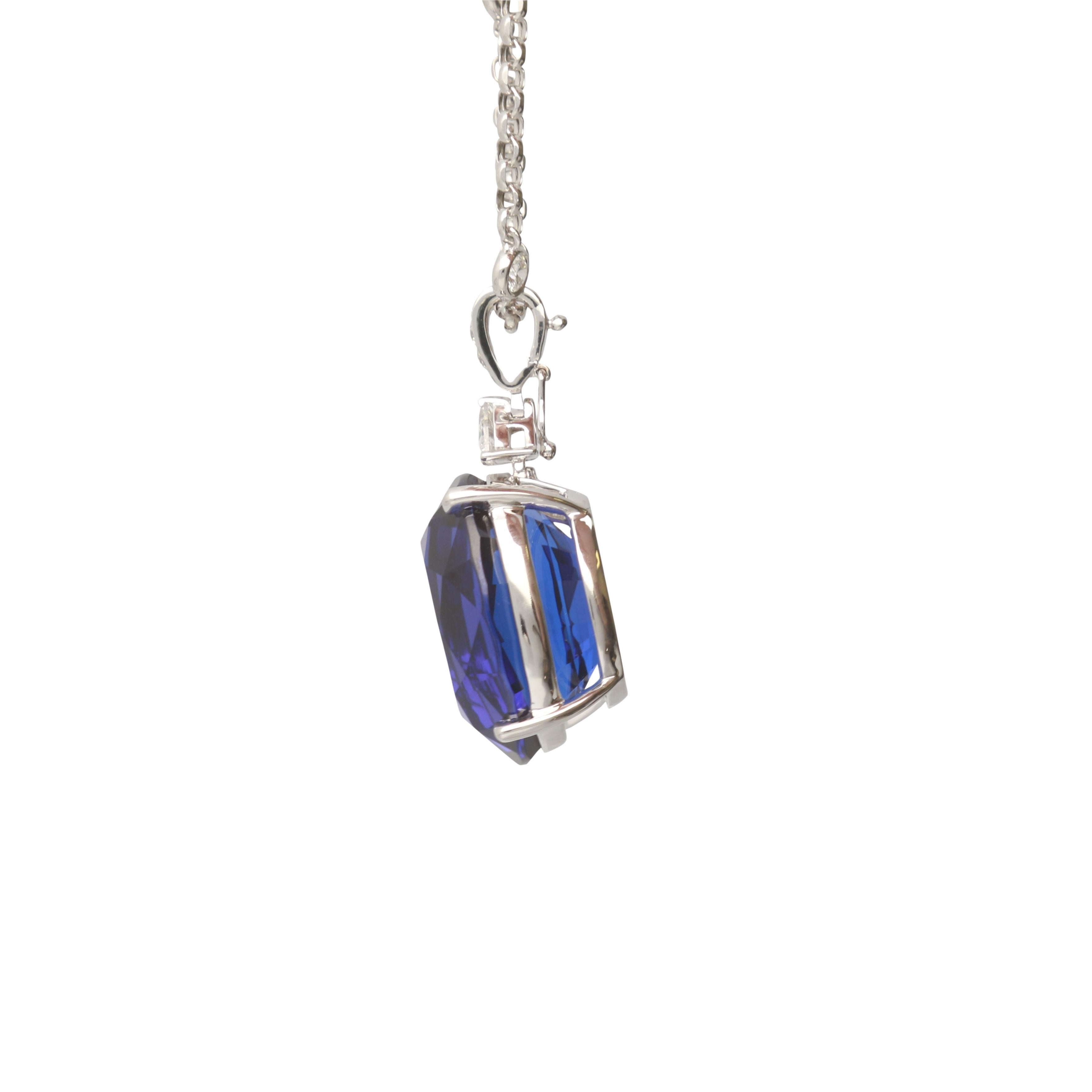 This one of a kind Necklace is crafted in 18-karat White Gold and features an oval cut IGL certified Tanzanite 37.39 Carat, 1 Trillian cut Diamond 0.33 Carat & 12 Round Brilliant cut Diamond 0.93 Carat. This Necklace comes with four bezel set