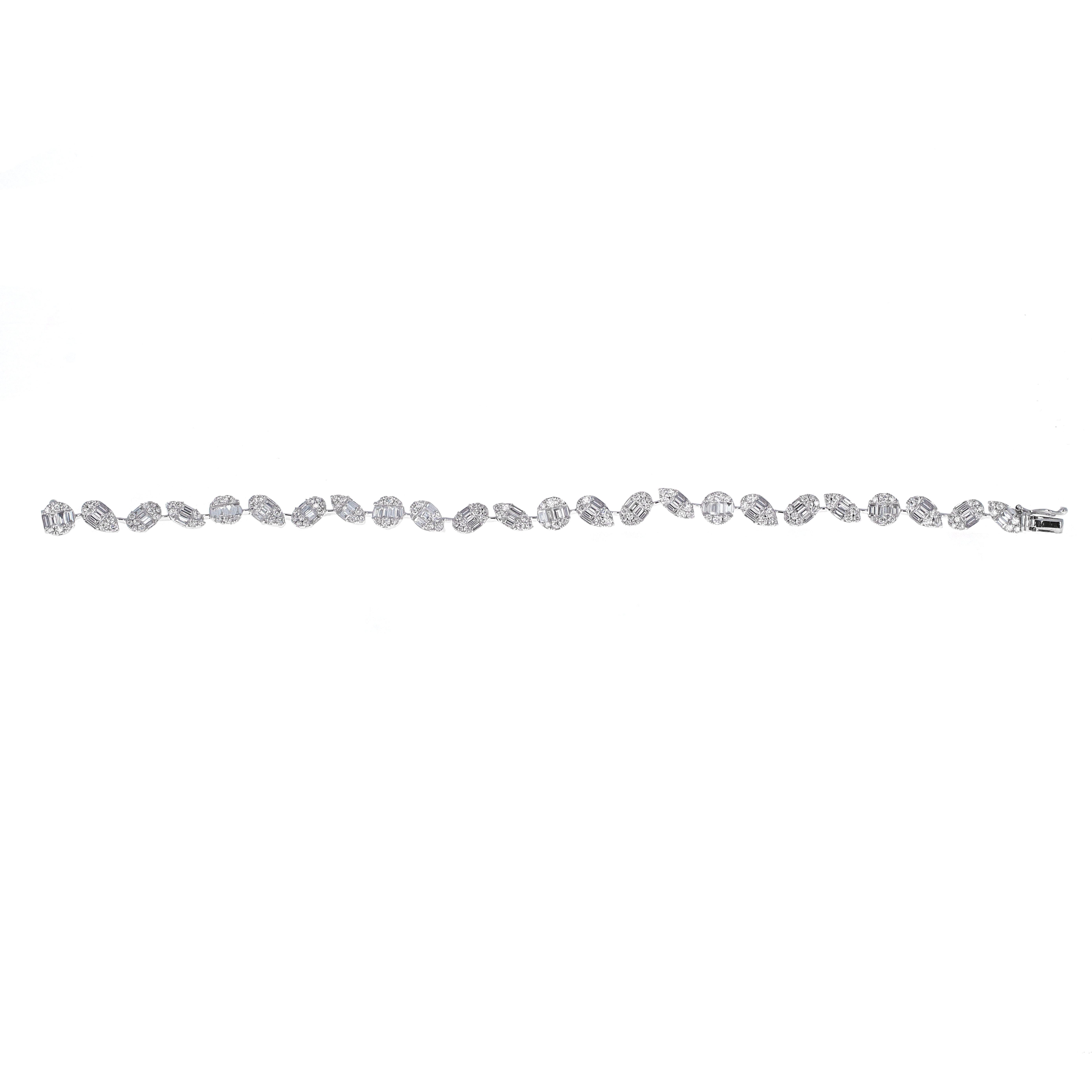 18 karat white gold illusion mixed shape diamond tennis bracelet. The bracelet is made up of smaller diamonds made to look like a larger stone. The diamond shapes are round, pear, oval and marquise shape. Each shape is made up of multiple round