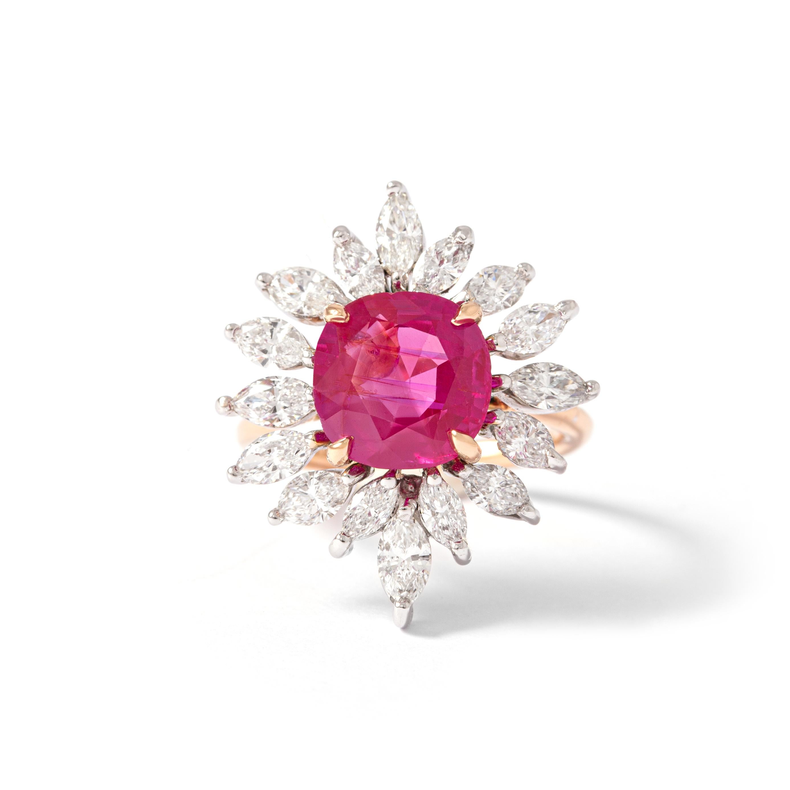 18K rose and white gold ring set with marquise-cut diamonds, centered with a cushion-cut ruby weighing 3.735 carats, natural, Burmese, unheated, per SSEF certificate: 90830.
5.48g gross weight.