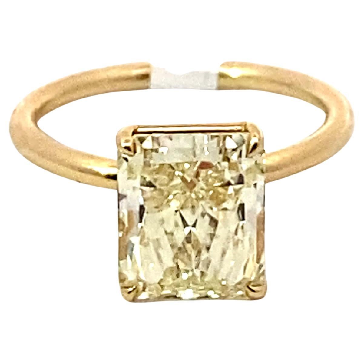 3.74 Ct Radiant Cut Fancy Light Yellow Diamond, VVS-1 18 Karat Yellow Gold Ring For Sale