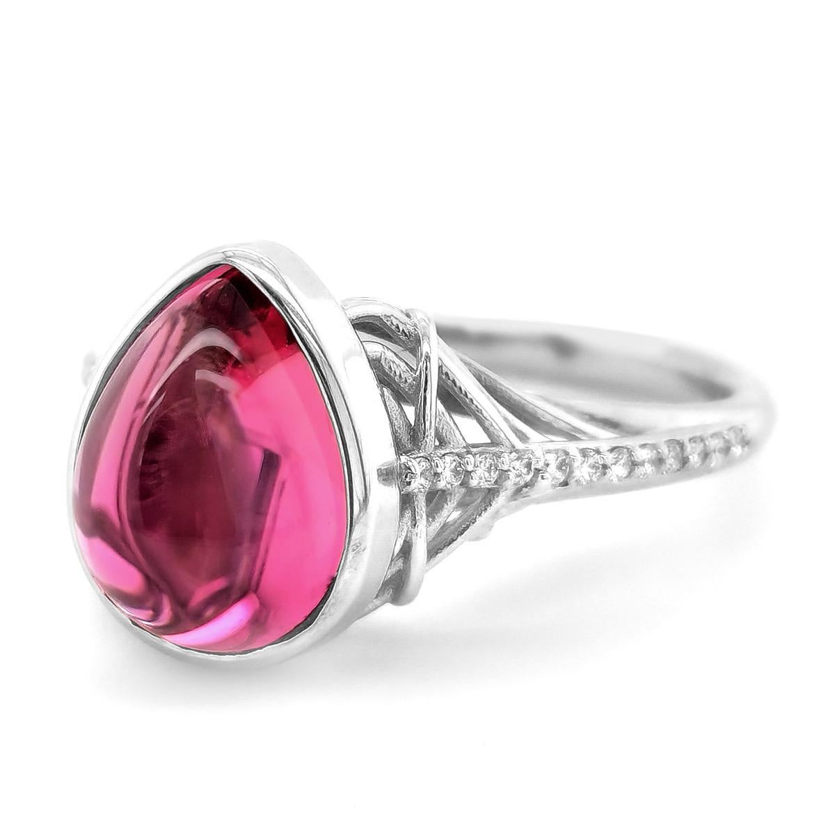 Tourmaline is known to symbolize friendship and wealth, and this 3.75 carat well crafted gemstone embodies just that. Cut as a cabochon, the gemstones grandeur is brought to life. Perfectly matched diamonds that compliment the gemstone, this ring is