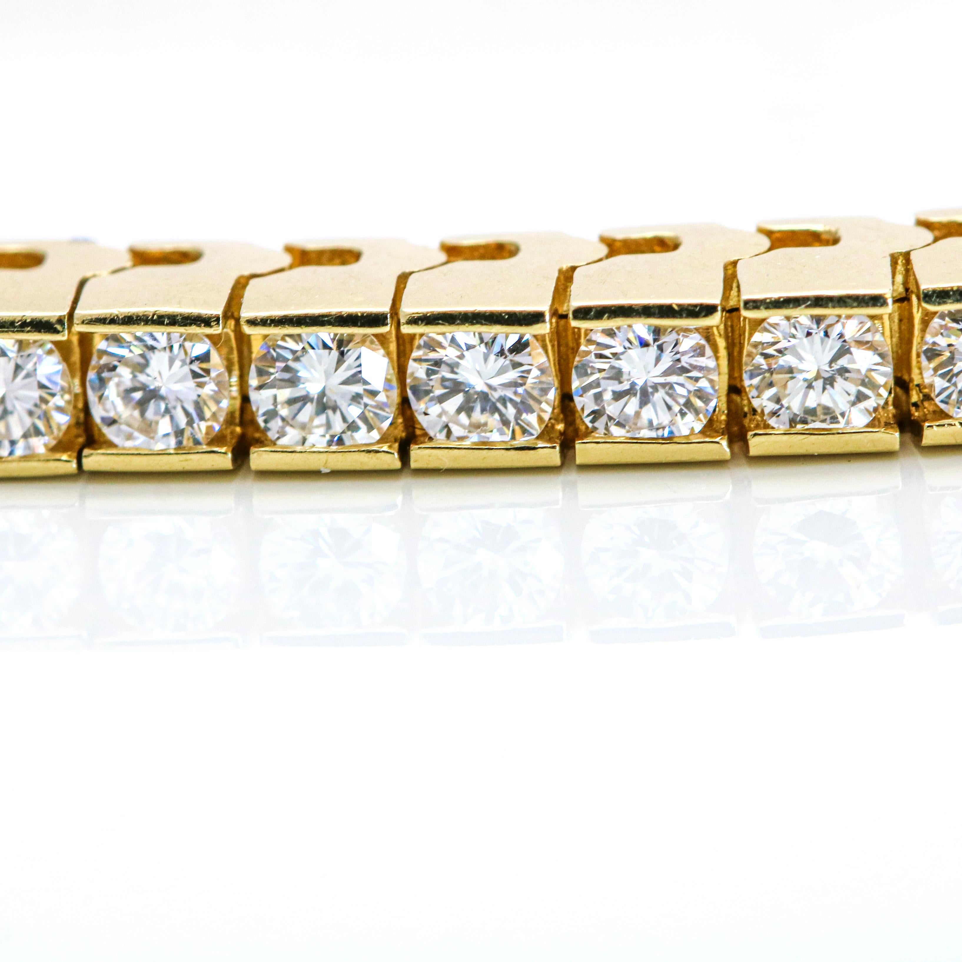 Classic diamond line bracelet in 14-karat yellow gold. The bracelet is channel set with 63 near colorless round brilliant cut diamonds. Slide clasp with safety.

Size, Medium
Length, 7 inches