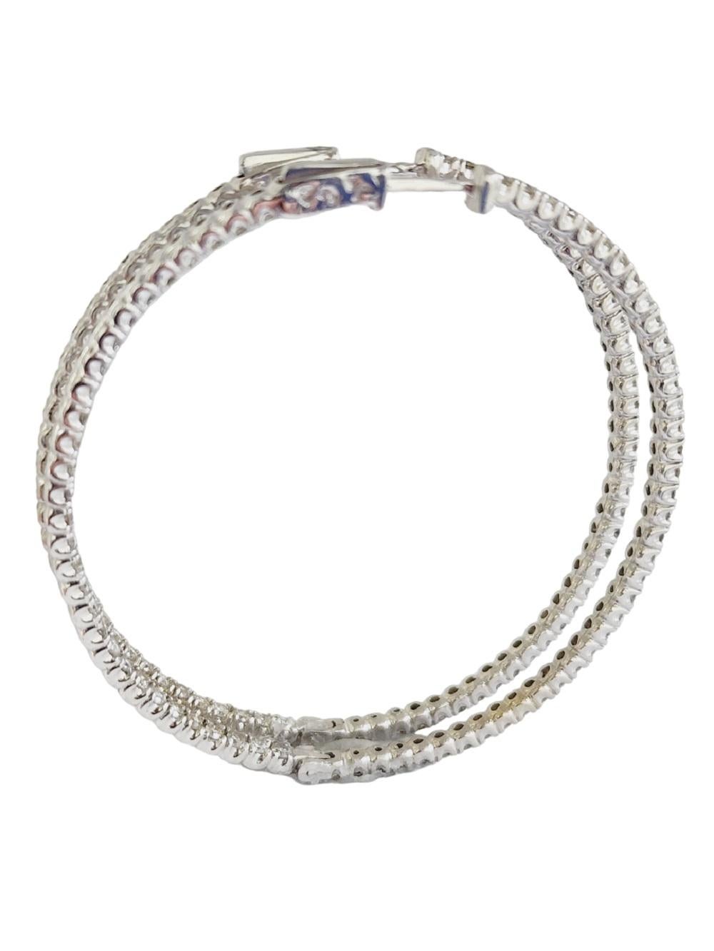 Beautiful pair of natural diamond large inside out hoop earrings in 14K white gold. Secures with snap closure for wear. 
Average Color I, Clarity SI, 
Measures 2 inch x 2 inch diameter. 