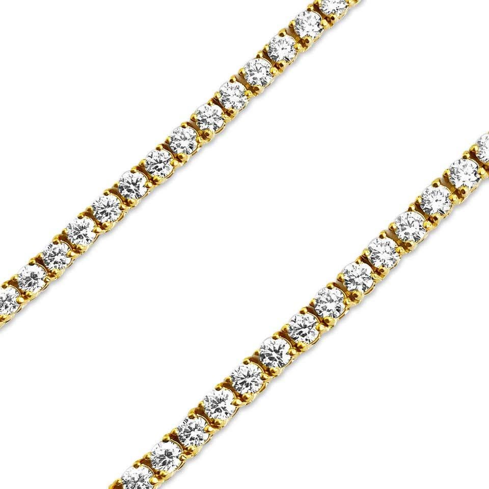 A brilliant and classic piece showcasing a line of round diamonds set in 14K Yellow Gold. All the diamonds in this necklace are brilliant round cut and weigh 3.75 carats total. 16 inches in length.