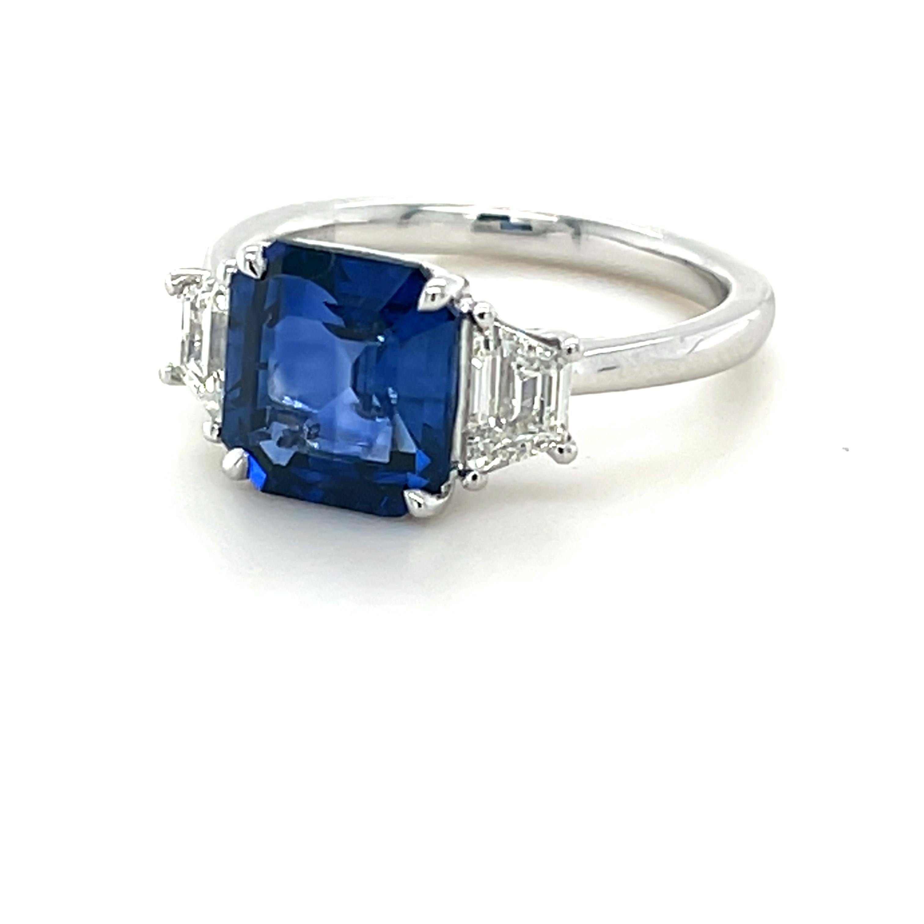 Emerald Cut Ceylon Sapphire weighing 3.75 carats
Two pieces of Trapezoid Diamonds weighing .71 carats
Set in platinum ring