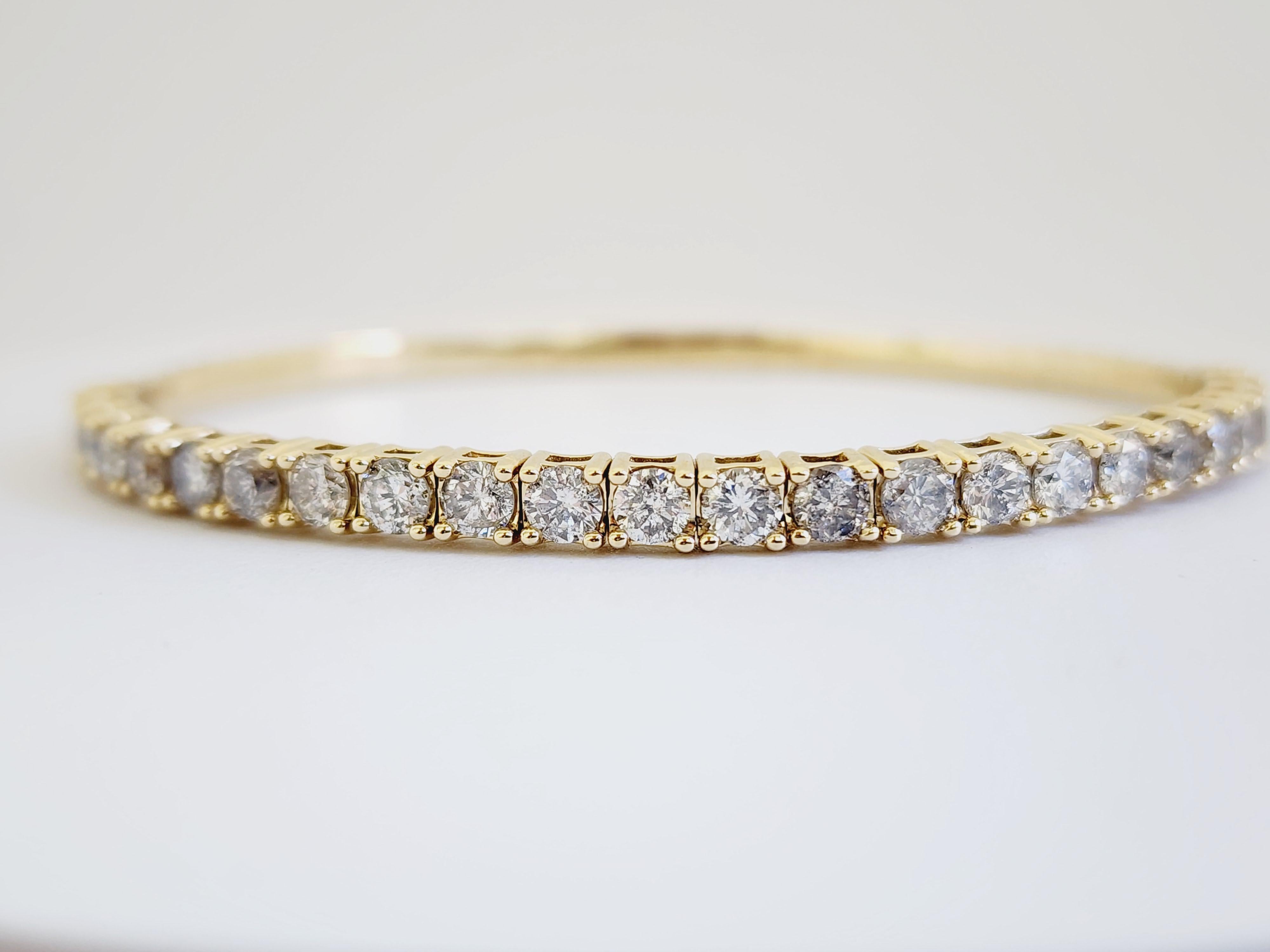 Natural Diamonds 3.75 ctw flexible halfway around bangle yellow gold 14k.
Average Color G, Clarity I, 3.80 mm wide. 7 Inch. 