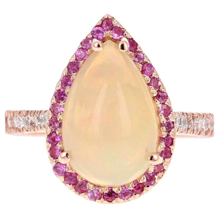 Anillo de oro rosa de 18 quilates con diamante y zafiro rosa, ópalo talla pera de 3,75 quilates
