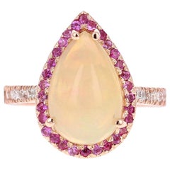 Bague en or rose 18 carats avec opale taille poire de 3,75 carats, saphir rose et diamants