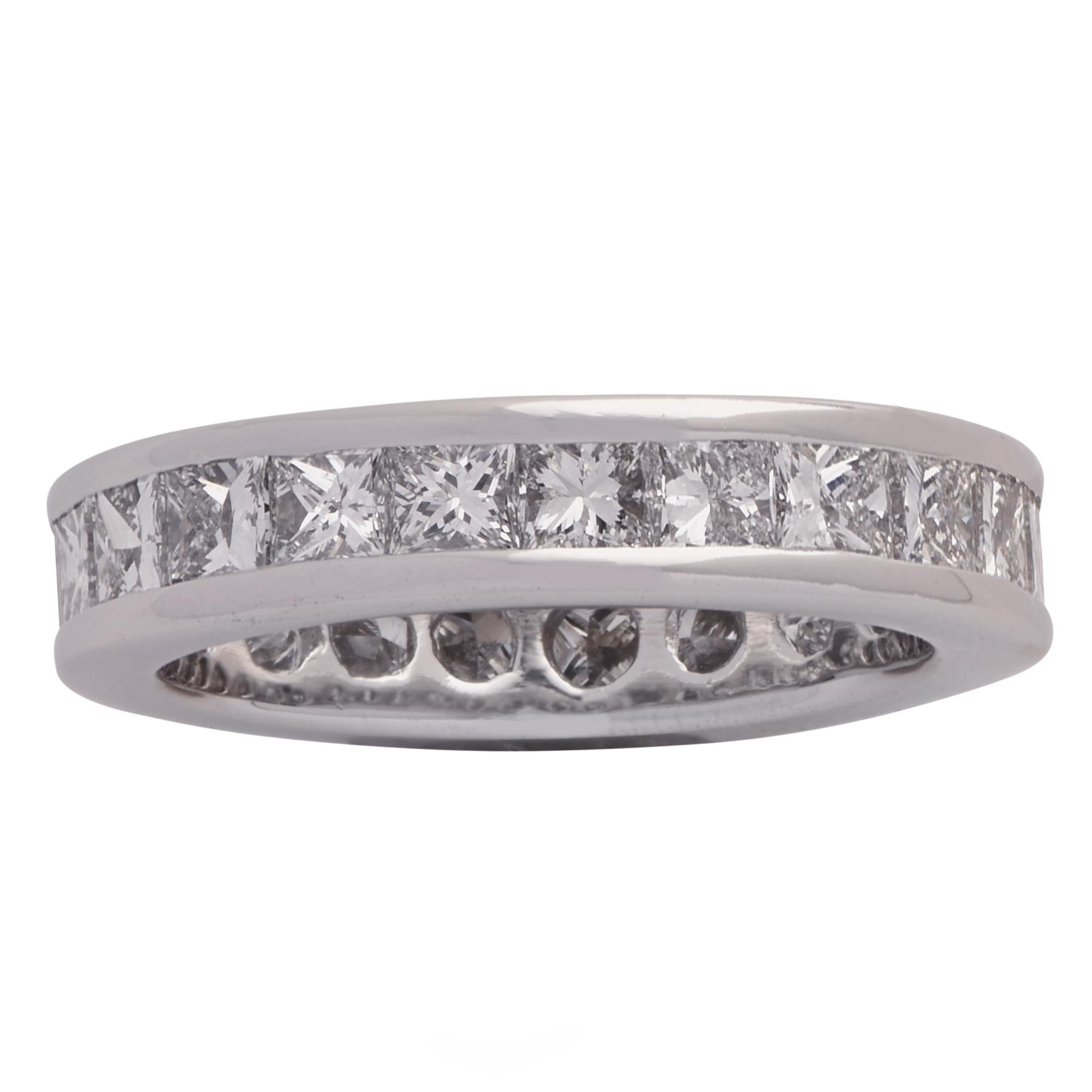 Classic eternity band crafted in platinum, featuring 20 princess cut diamonds weighing approximately 3.75 carats total, G color VS clarity. The princess cut diamonds are channel set, creating a stream of eternal brilliance and fire. This beautiful