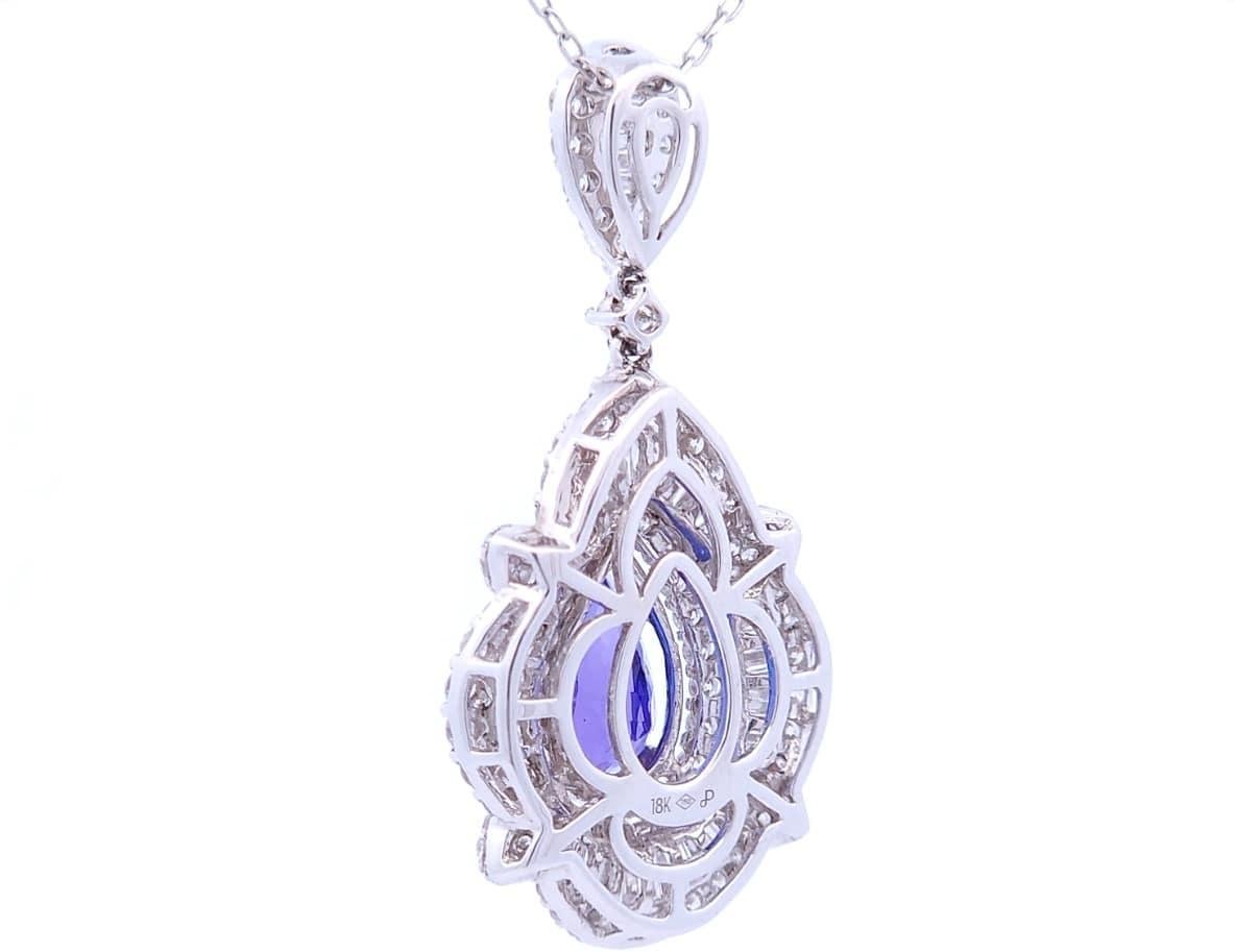 Quality, at the right price.

This designer pendant features a 3.75 carat pear shaped tanzanite as the center stone. Surrounding the tanzanite are two types of diamonds. There are round diamonds with a total carat weight of 1.31 carats and there are