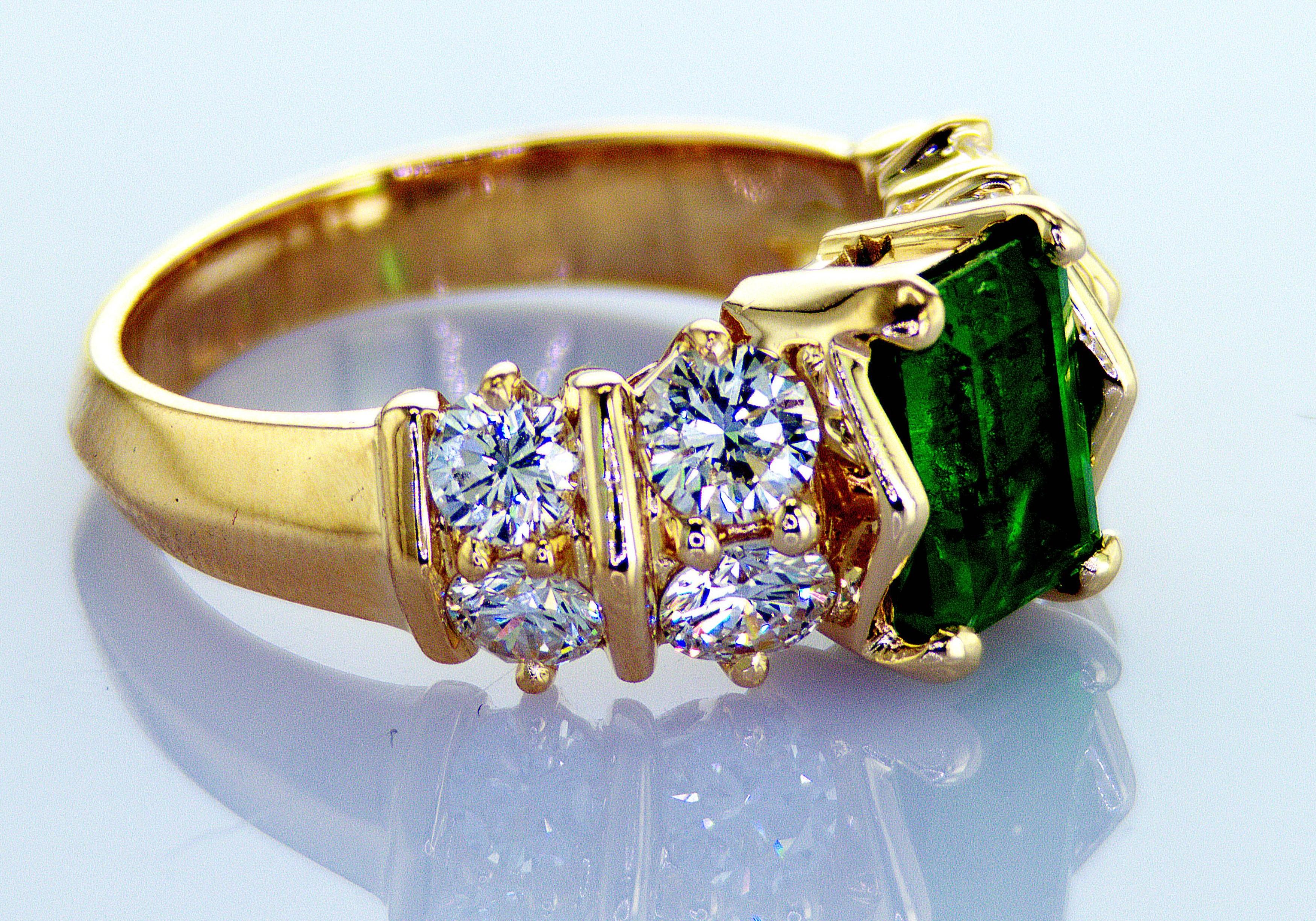 Ring size: 7.25

This stunning band ring has incredible color, significant sparkle and a beautifully unique design. The exquisite emerald stone pops with its  vibrant green hue at the center while the sparkling diamonds shine against the warm yellow