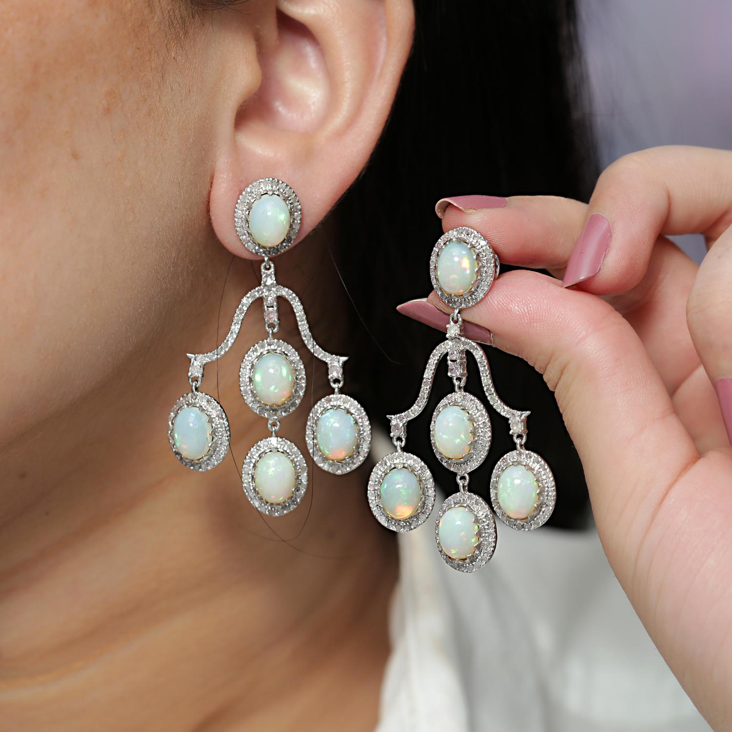 925 Sterling Silver Diamond Opal Earring
Gross Weight: 22.380
14k Gold Weight: 2.520 Cts.
Silver Weight: 16.410 gms
Diamond Weight: 3.75 Cts.
Opal Weight: 13.50 
Dimension: Size- 55x35 mm
