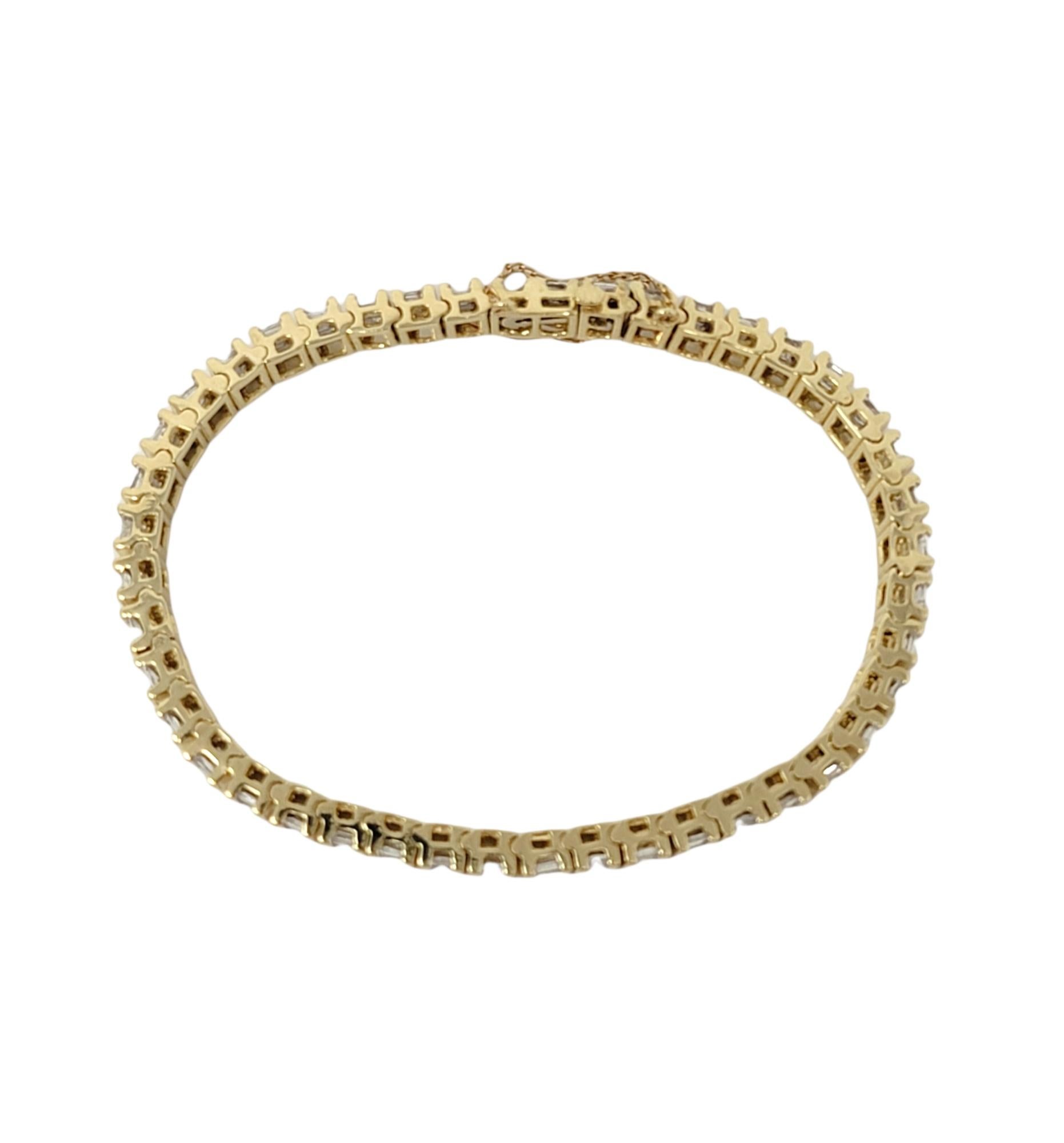 Contemporary 3.75 Carats Total Baguette Diamond 14 Karat Yellow Gold Bar Link Tennis Bracelet For Sale
