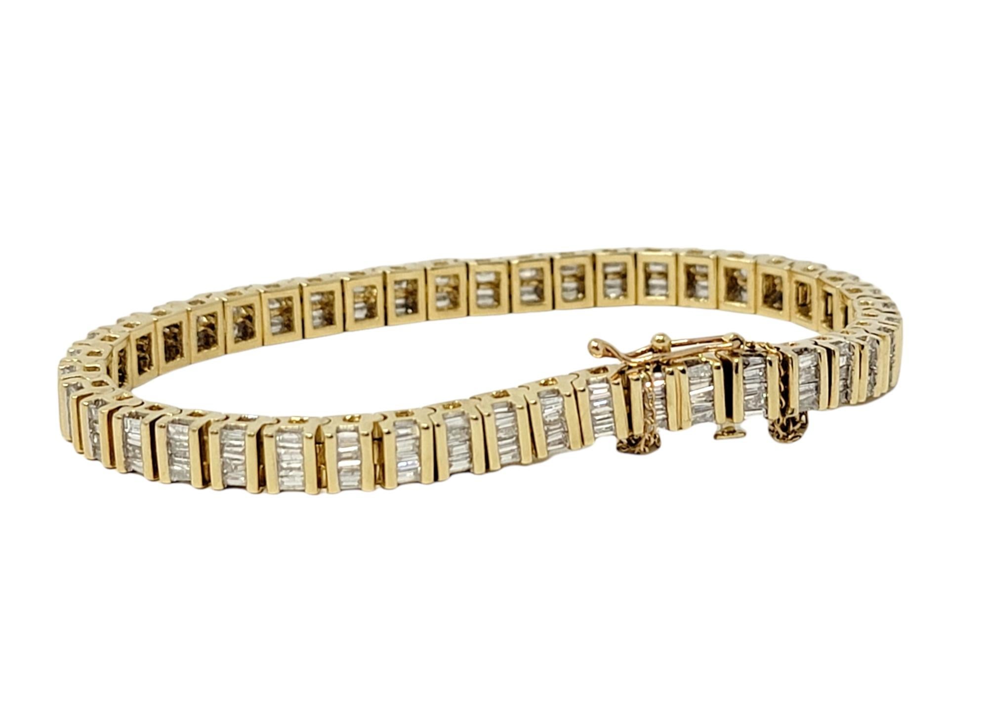 Baguette Cut 3.75 Carats Total Baguette Diamond 14 Karat Yellow Gold Bar Link Tennis Bracelet For Sale