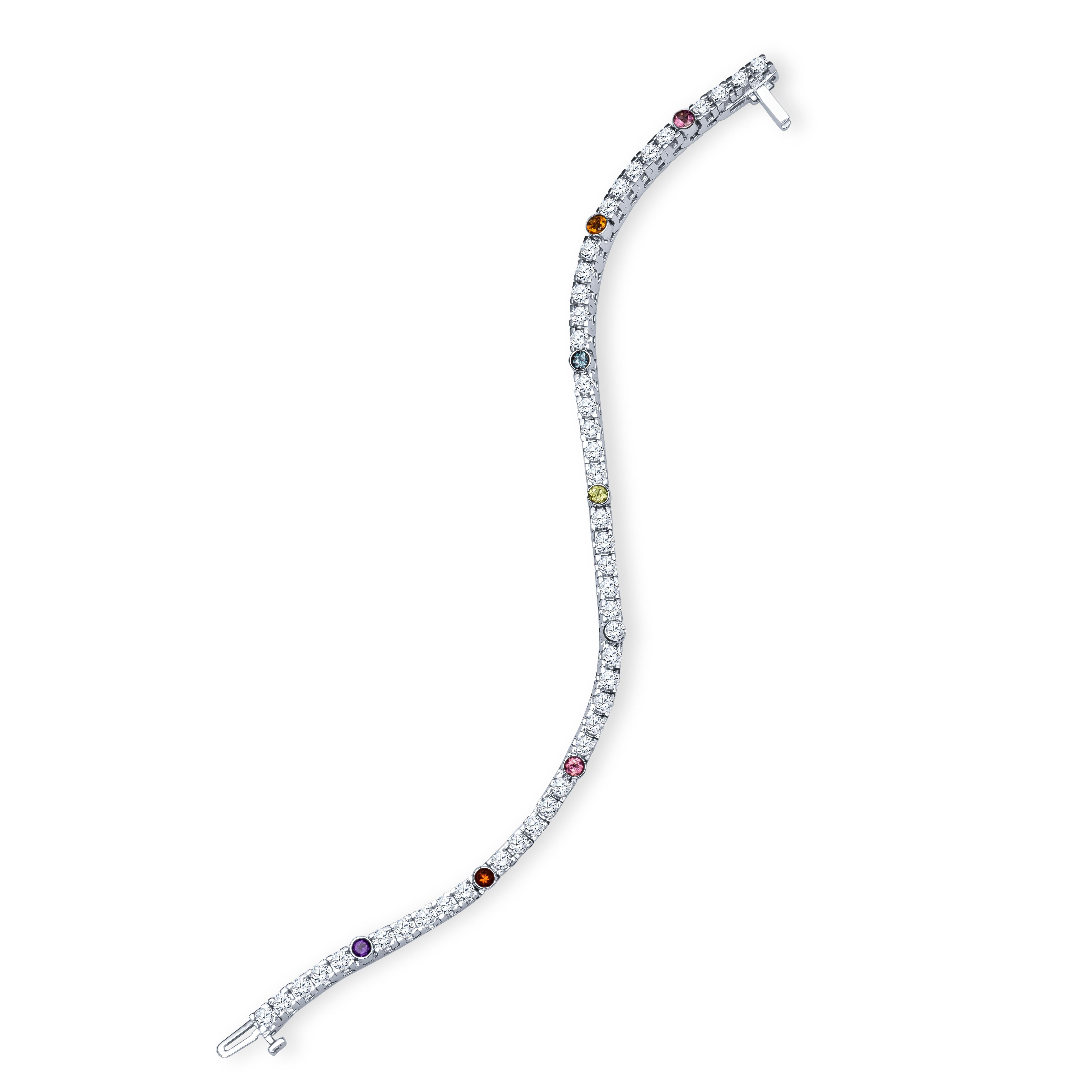 14K white gold tennis bracelet with approximately 3.75 cts total in round diamonds and multi-color semi-precious accent stones. Accent stones include amethyst, garnet, tourmaline, peridot and citrine.