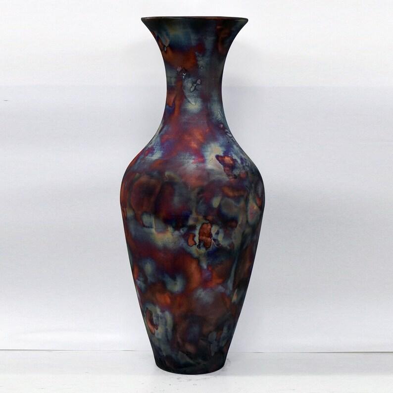 The Grand Vase is a 37.5 inch tall Art Series piece that is fired in the signature RAAQUU full copper matte finish. Be it in your living room or as a pair greeting your guests at entrances, the Grand Vase is a piece that will becomes a unique part