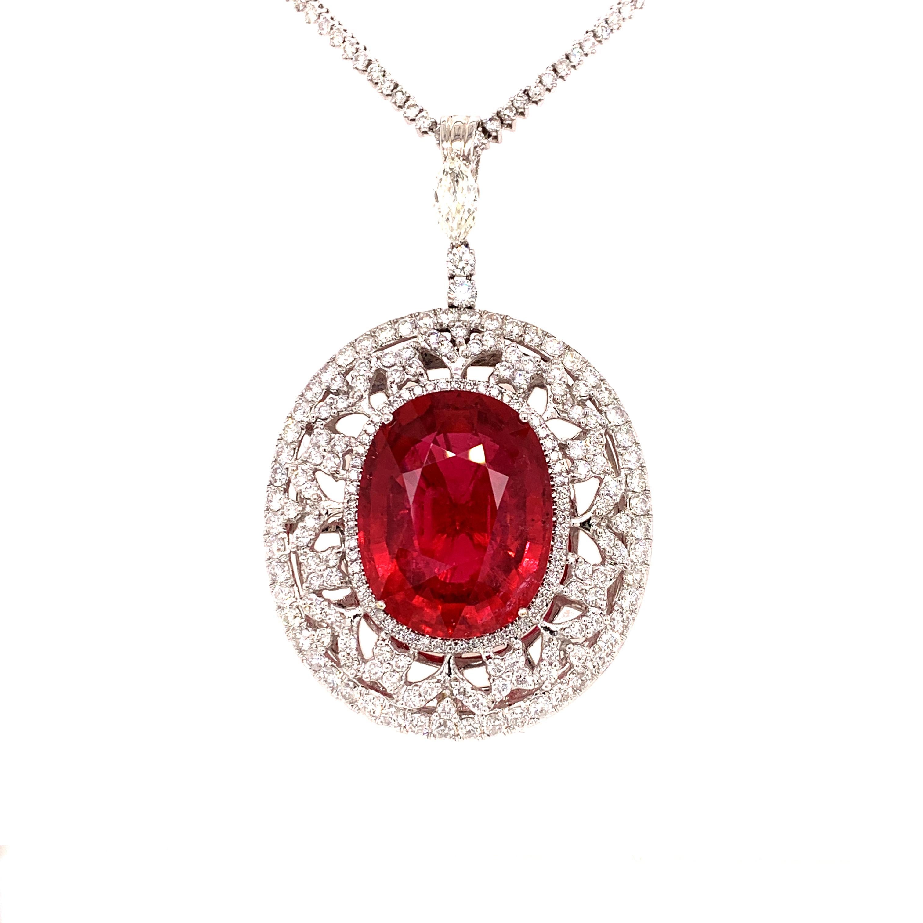 Rare, large rubellite tourmaline diamond necklace. High cluster, lively pinkish red, oval faceted natural rubellite mounted with four prongs, accented with a round brilliant cut diamond design. Glamorous design set in 18 karats white gold,