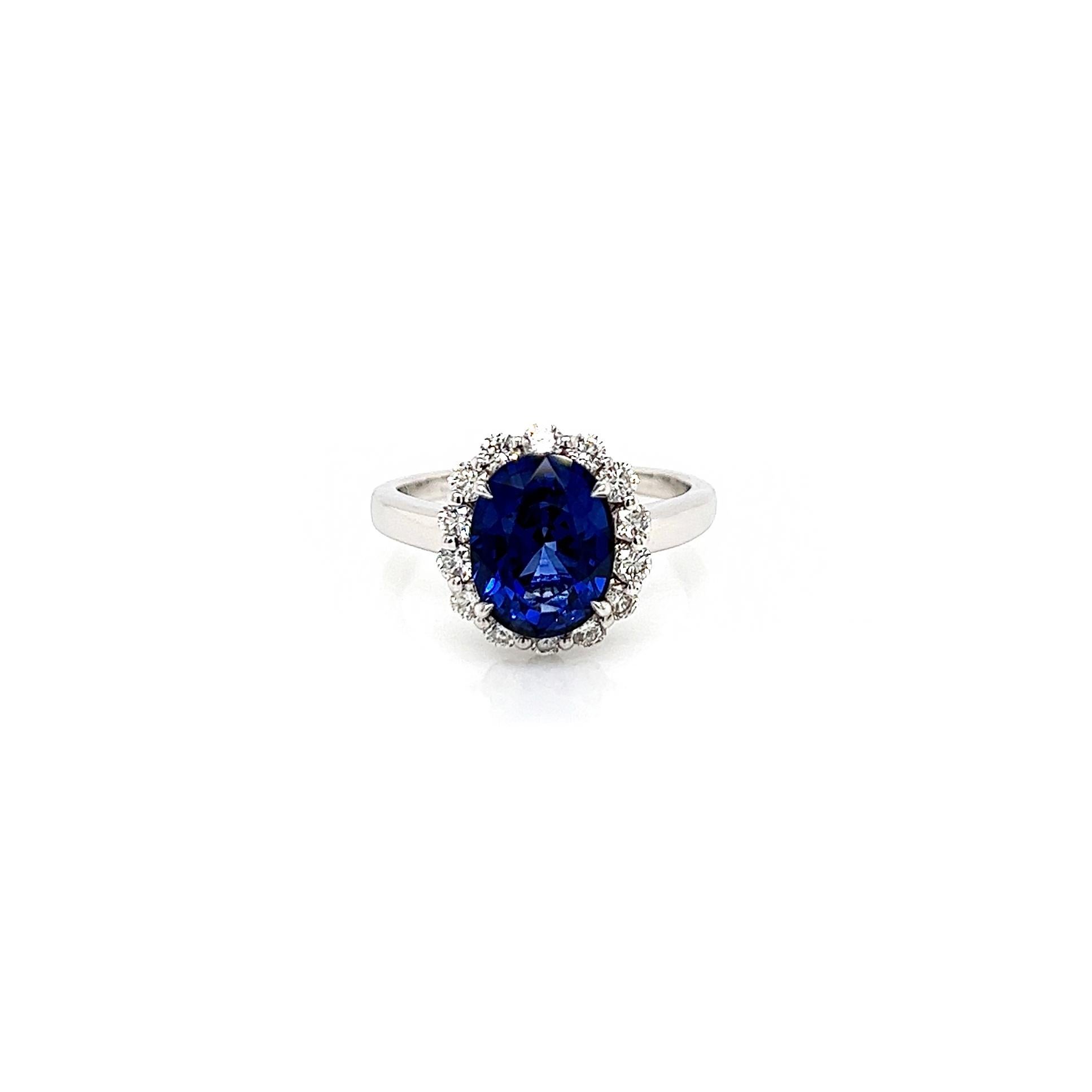 3.75 Total Carat Sapphire and Diamond Halo Ladies Engagement Ring

-Metal Type: 18K White Gold
-3.22 Carat Oval Cut Natural Blue Sapphire, Heat Treated
-0.53 Carat Round Natural side Diamonds. F-G Color, VS-SI Clarity 

-Size 6.25

Made in New York