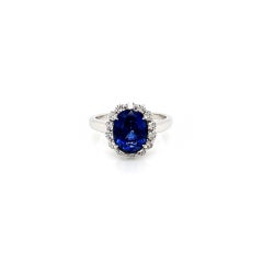 3.75 Total Carat Oval Blue Sapphire and Diamond Halo Ladies Engagement Ring
