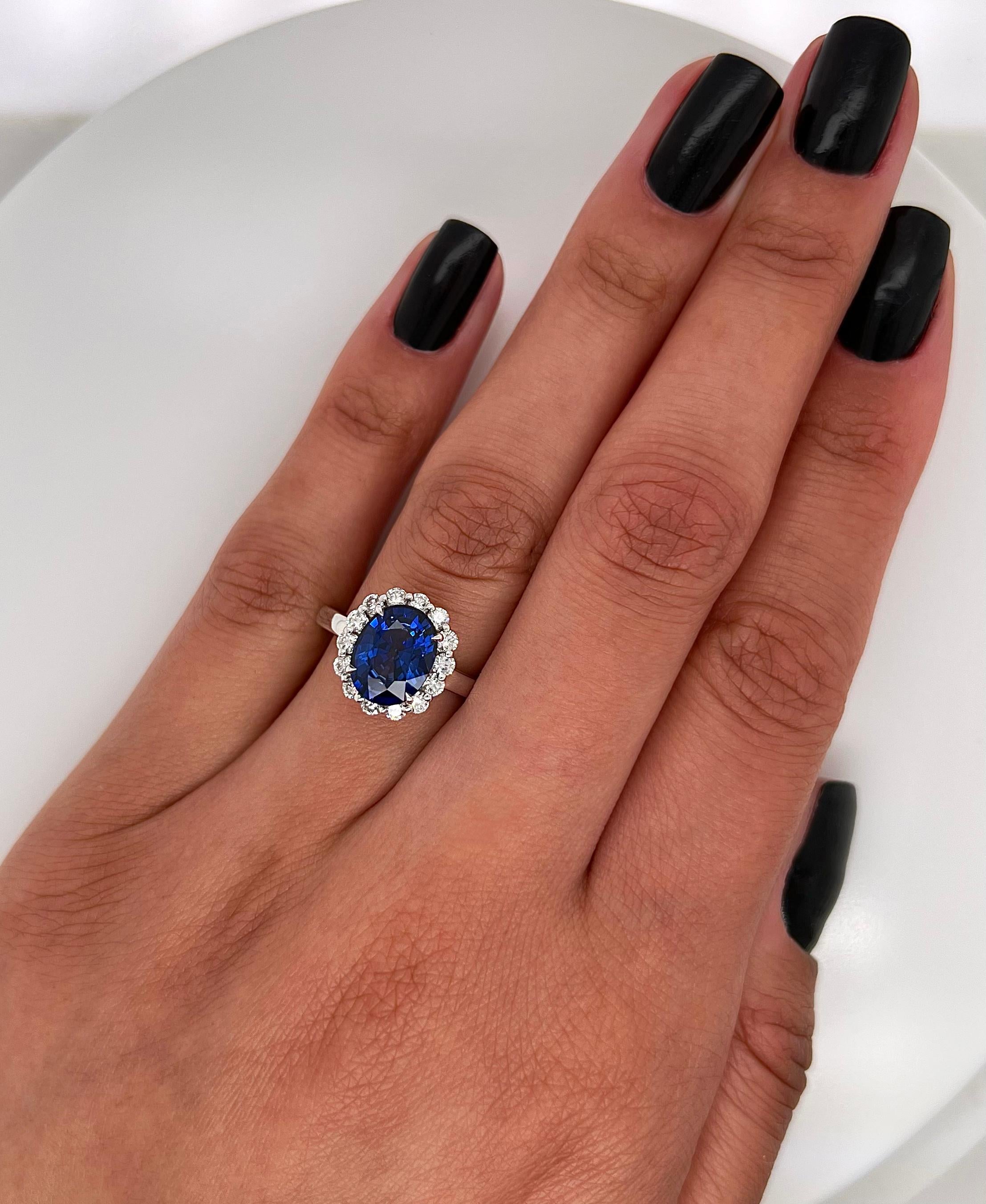 3.75 Total Carat Oval Blue Sapphire and Diamond Halo Ladies Engagement Ring In New Condition For Sale In New York, NY