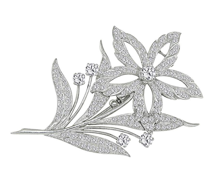 This is an amazing platinum flower pin. The pin is set with sparkling round cut diamonds that weigh approximately 3.75ct. The color of these diamonds is H-I with VS2 clarity. The pin measures 70mm by 46mm and weighs 22.5 grams.