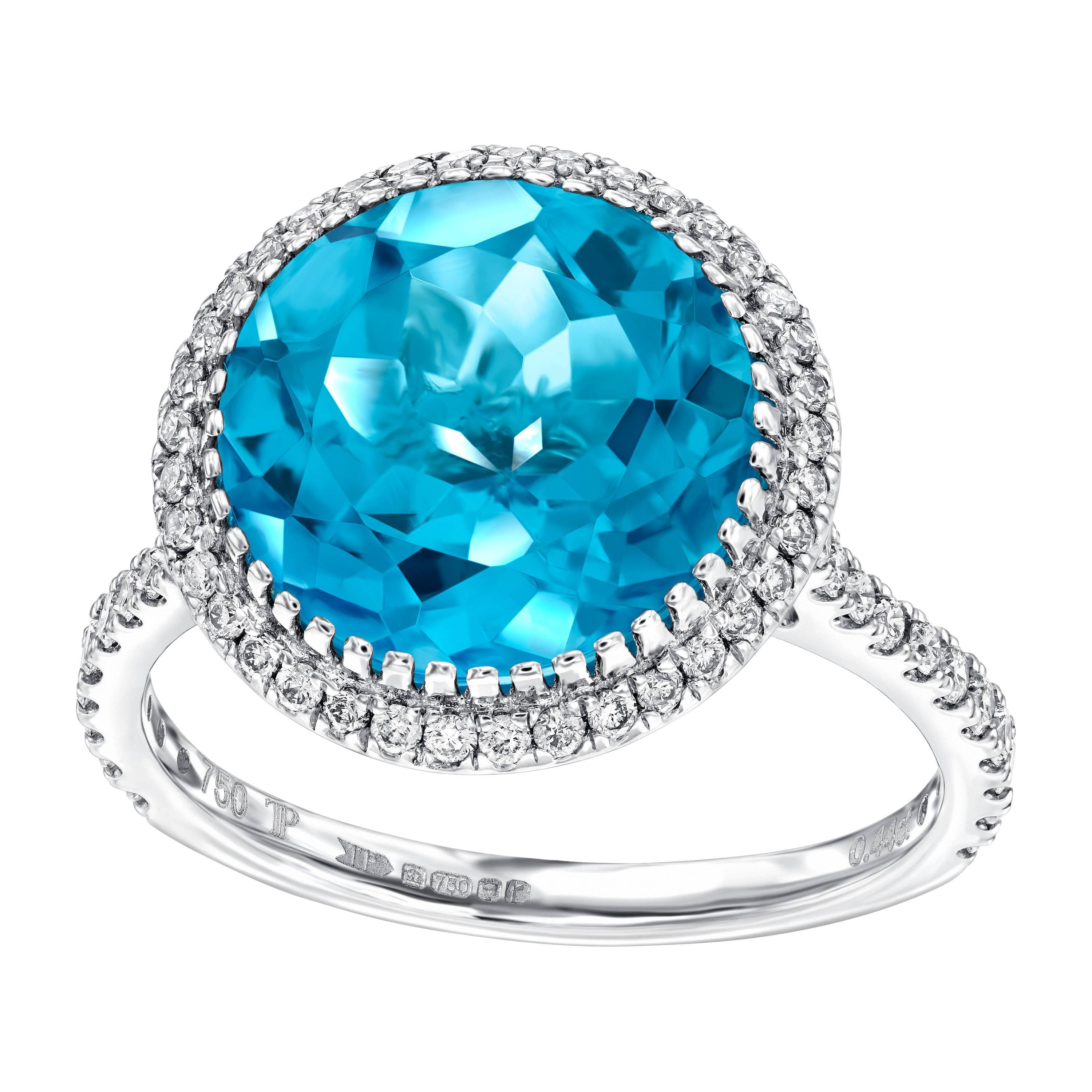 This beautiful 3.75ct Round Cut Blue Topaz Engagement Ring surrounded by 0.38 Carats in a pave setting, featuring a halo of Round Brilliant Diamonds  enhancing its extreme sparkle. Set in 18ct white gold this ring has a total weight of 4.13ct. With