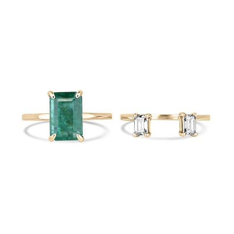 This ingenious convertible ring offers the ultimate in versatility, designed as a two-in-one piece that seamlessly transforms from a solitaire to a three-stone ring. The main band features a lush green emerald-cut emerald, set in four claw prongs,