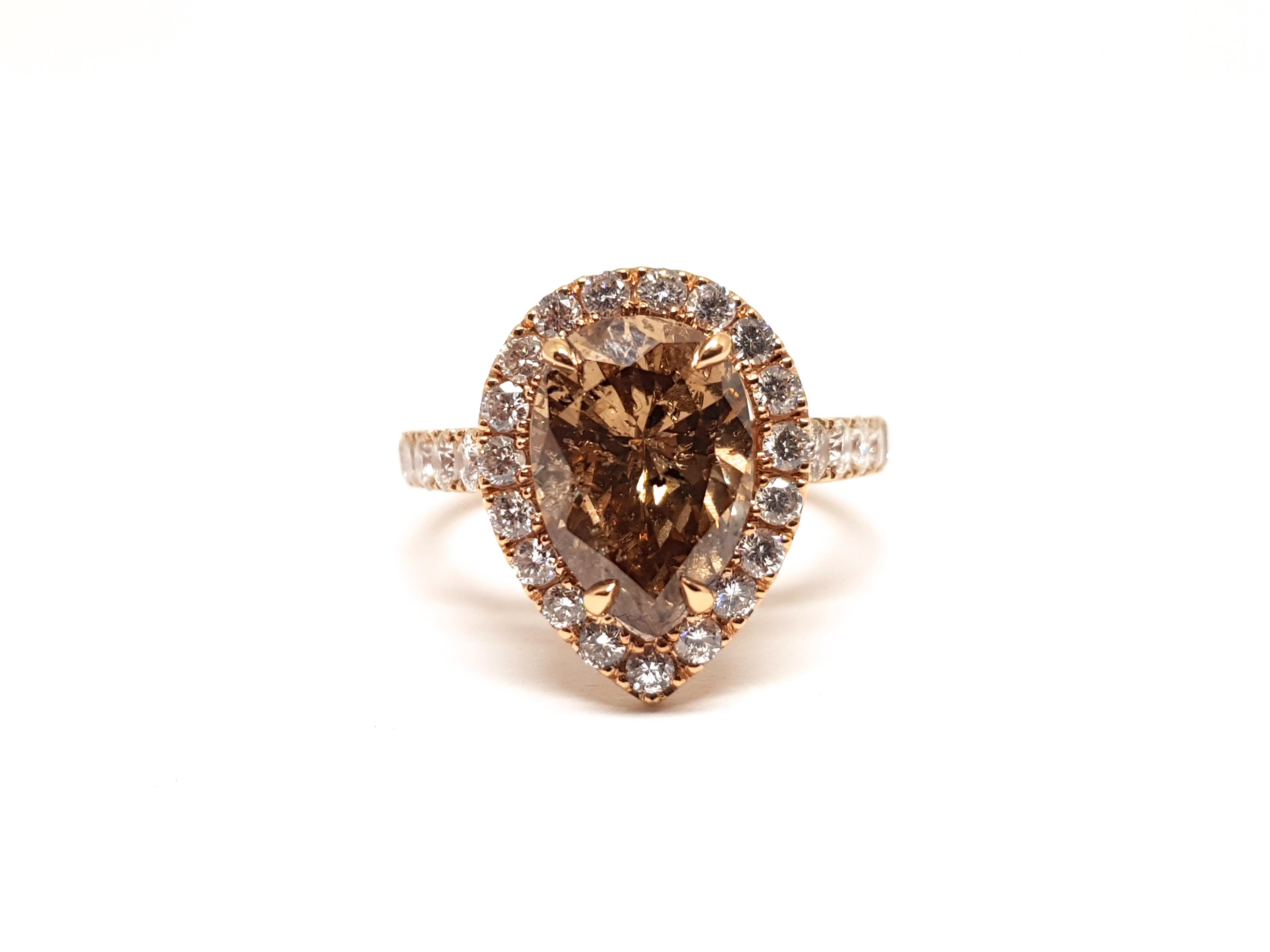 Gold: 18 carat pink rose gold 
Weight: 6.29 grams 
Center Diamond: 2.76 ct. Fancy Brown / SI2
Accent Diamonds: 1.00ct. F / VS2
Ringsize: US 6.75 / Euro 54 / 17.25
Free resizing of Ring up to size 70 / 22mm / US 13 
Width: 1.6 cm 
All our jewellery