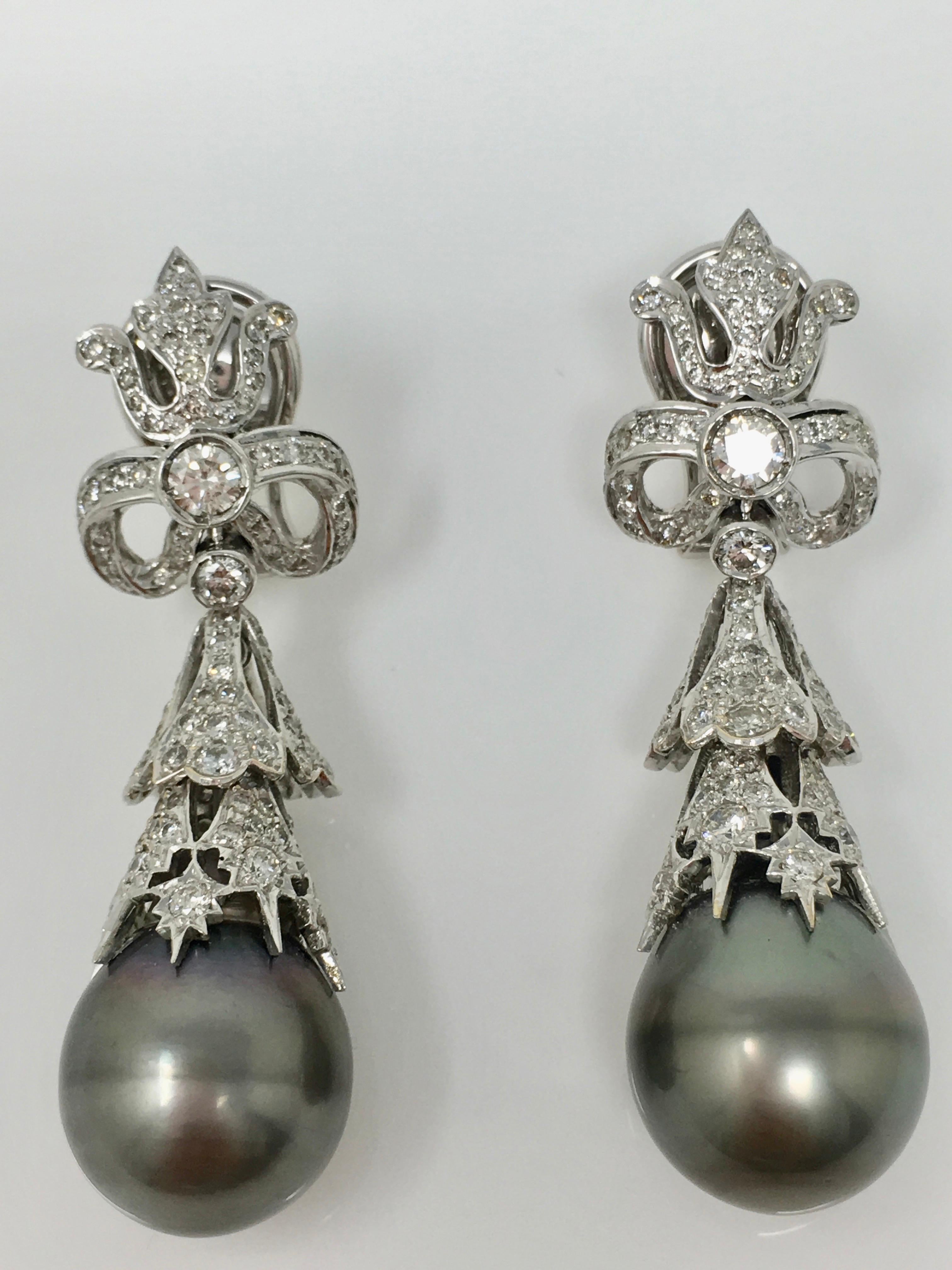 This gorgeous and unique chandelier earrings by Moguldiam Inc features 3.76 carat of white round brilliant diamond with VS clarity and GH color and grey two south sea pearls with beautiful lusture and quality of 14.5mm by 15.5mm each. This wonderful