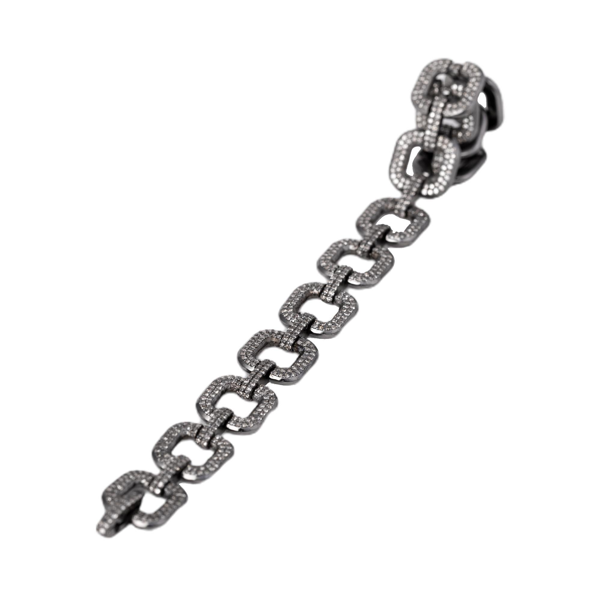 3.77 Carat Diamond Link Tennis Bracelet in Victorian Style

This Victorian era art-deco nouveau style diamond link bracelet is timeless. The cushionish-square hollow link is formed with two rows of pave set round diamonds. The two vertical rows of