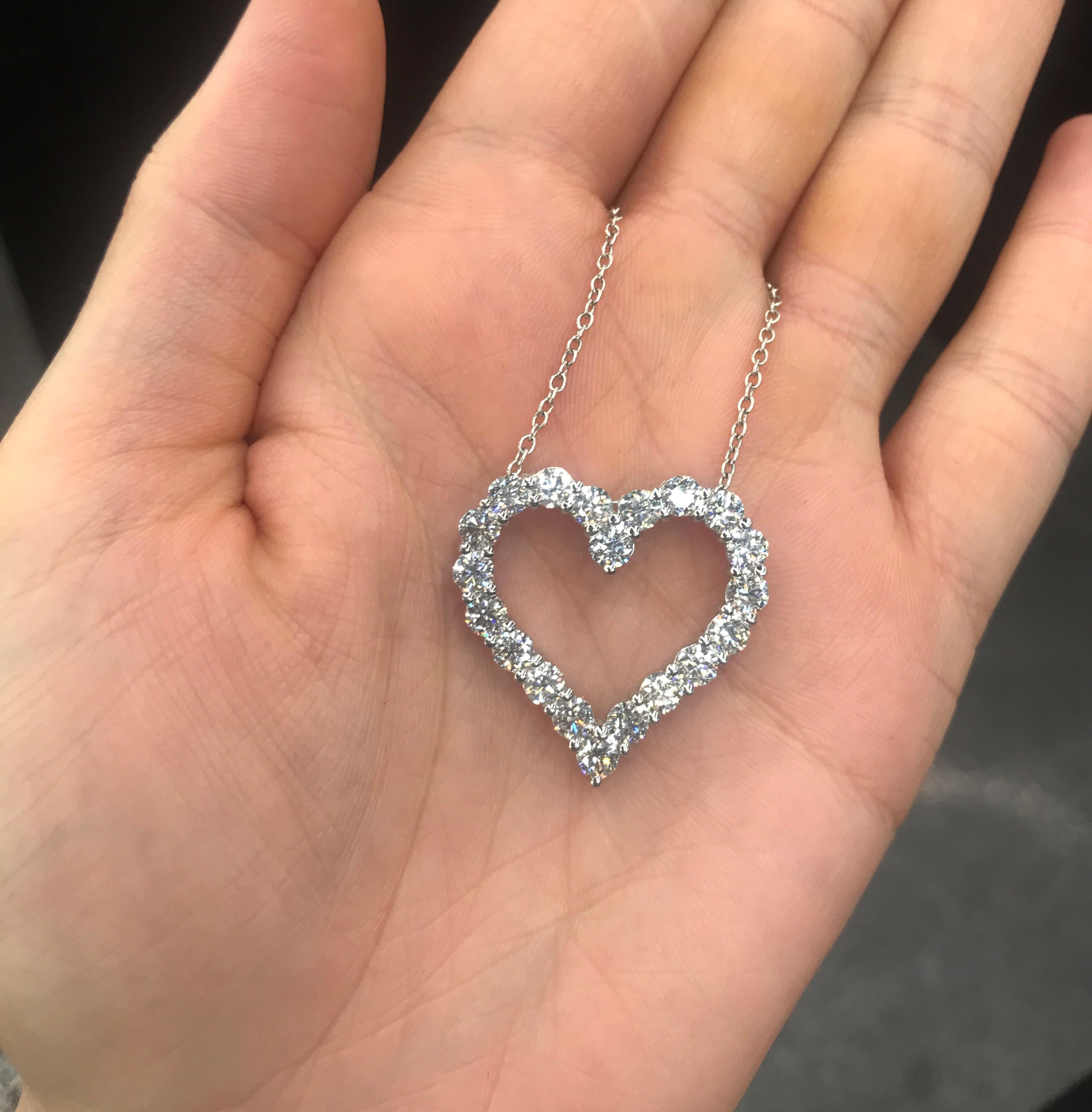 14KT White gold heart pendant featuring 20 round brilliants weighing 3.77 carats.
Color: G
Clarity: VS
A real show stopper!!

Can customize in any size, quality or gemstone. 