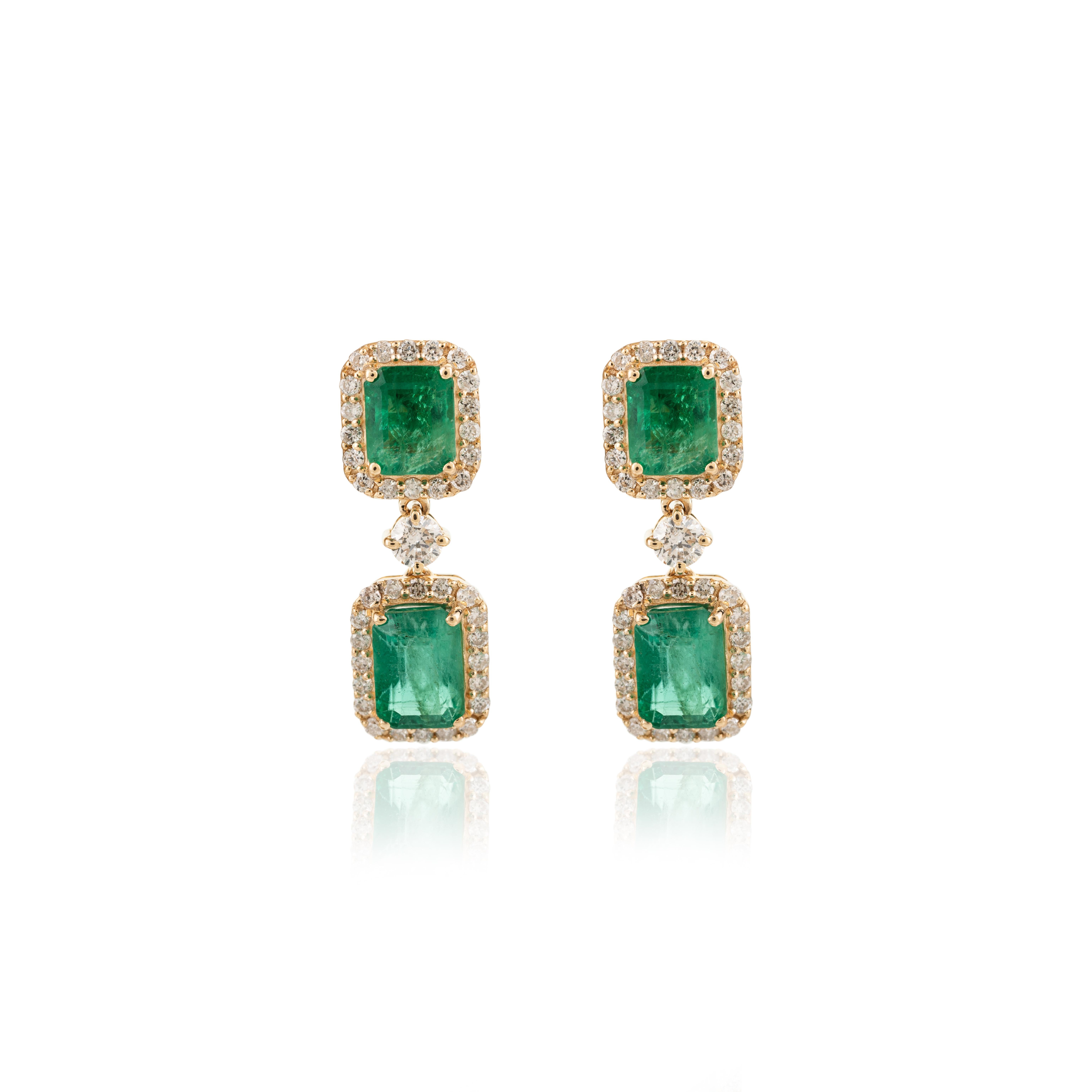 Art Deco 3.77 Carat Emerald May Birthstone Halo Diamond 18k Yellow Gold Dangle Earrings For Sale